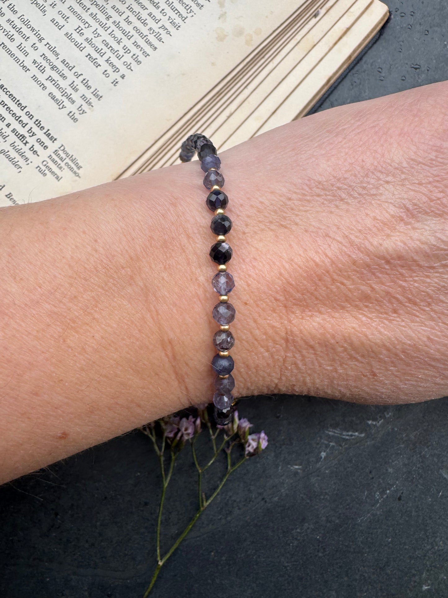 Iolite faceted stone, gold metal, bracelet