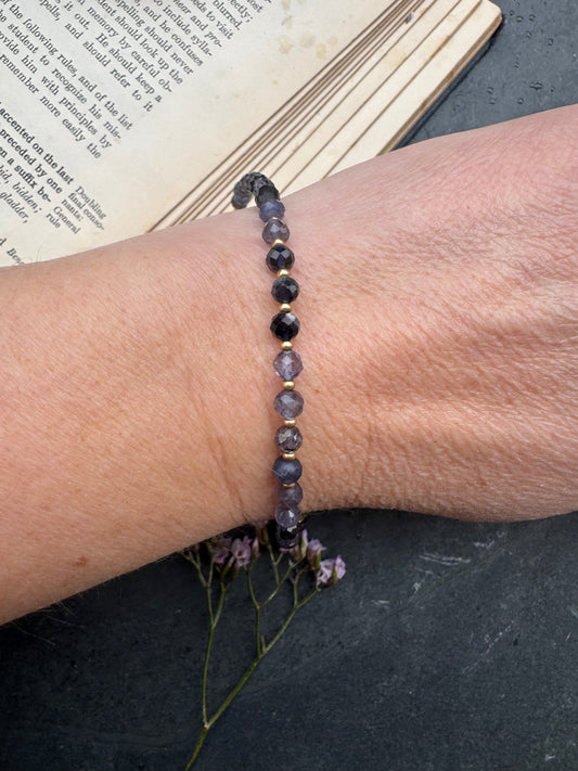 Iolite faceted stone, gold metal, bracelet