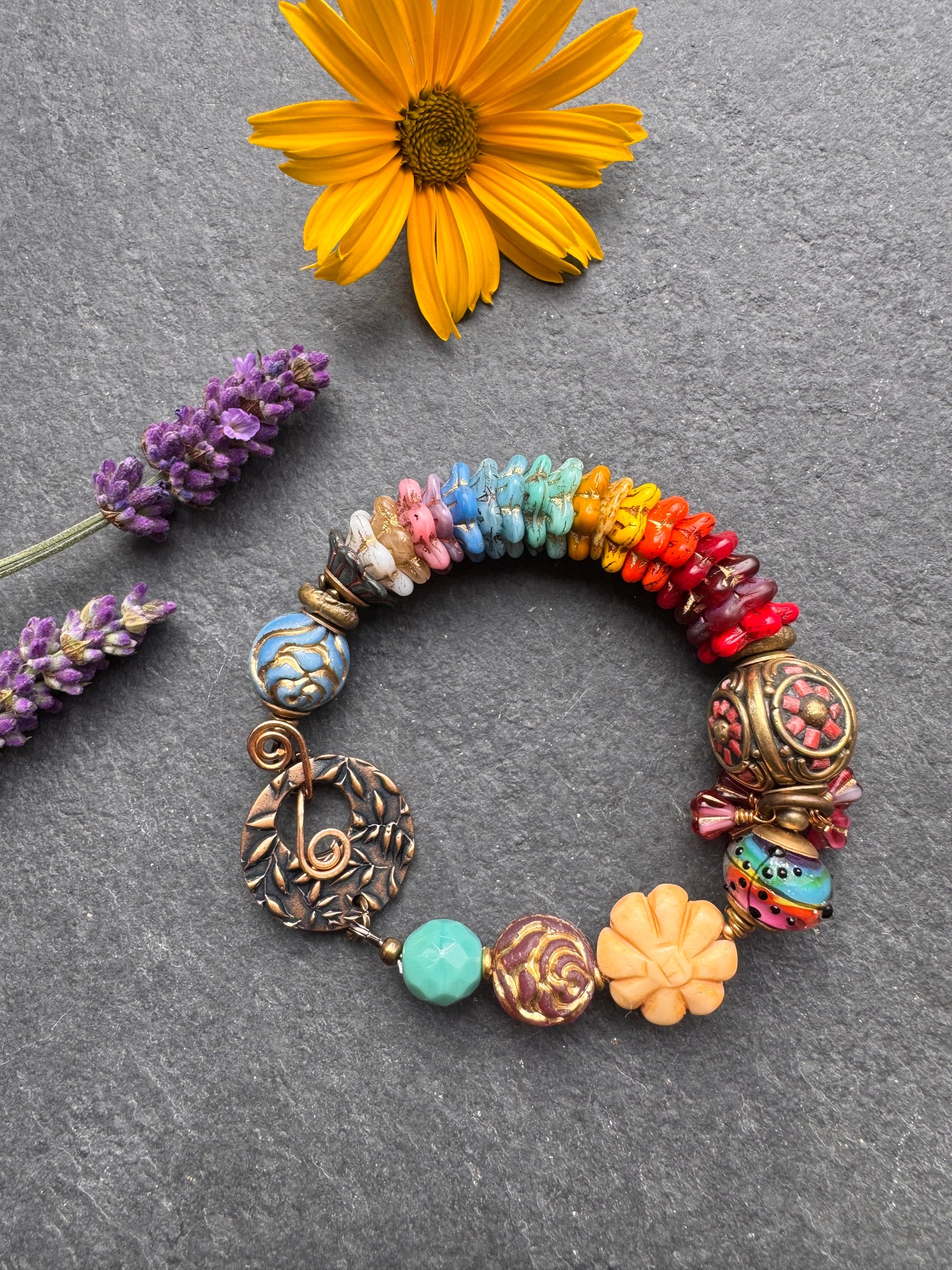 Rainbow flowers. Nepal coral flower bead, Mixed Czech glass flowers, lampwork glass, leaf bronze toggle clasp.