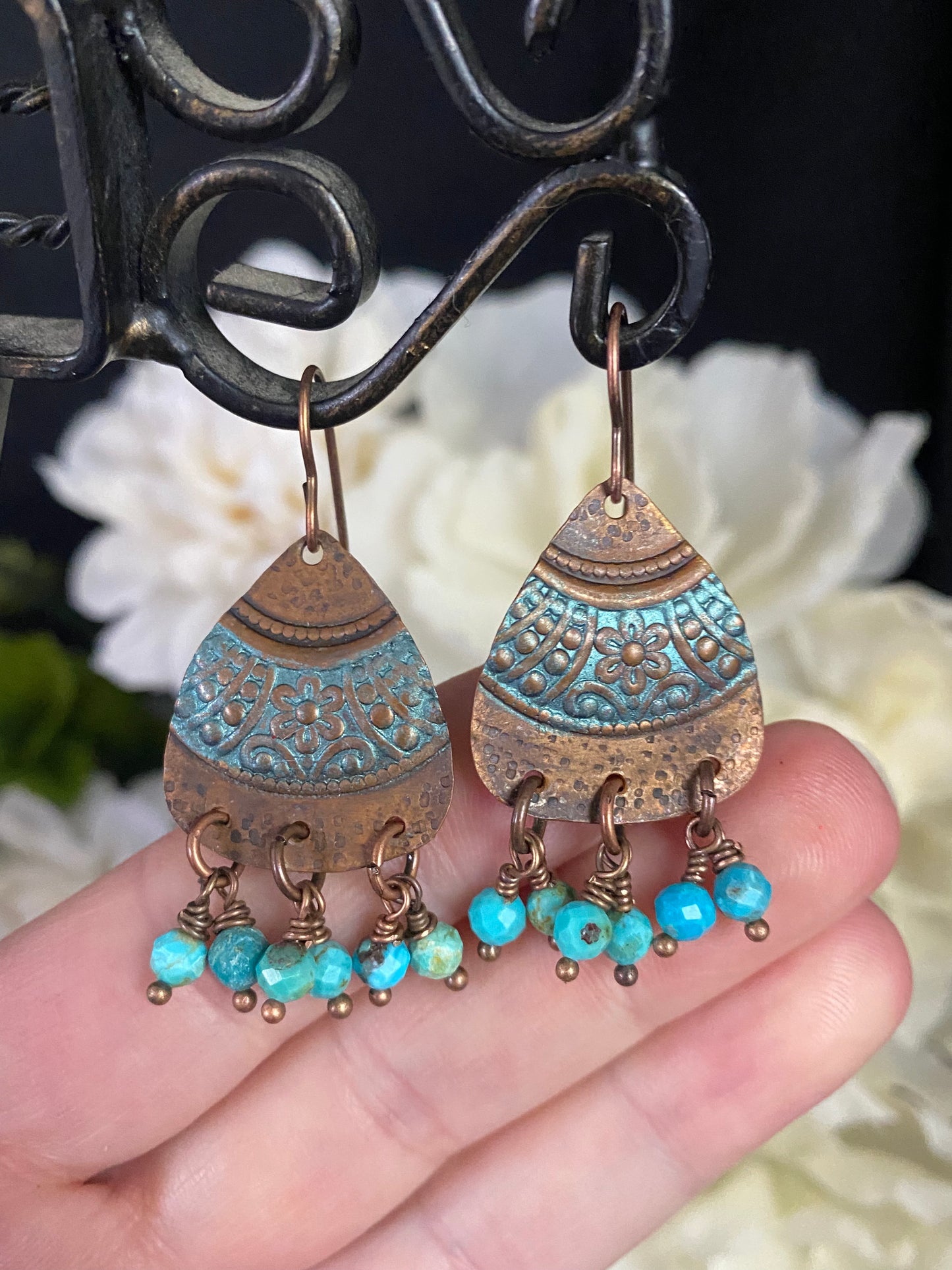 Turquoise stone and handmade  flower detailed charms, copper earrings.