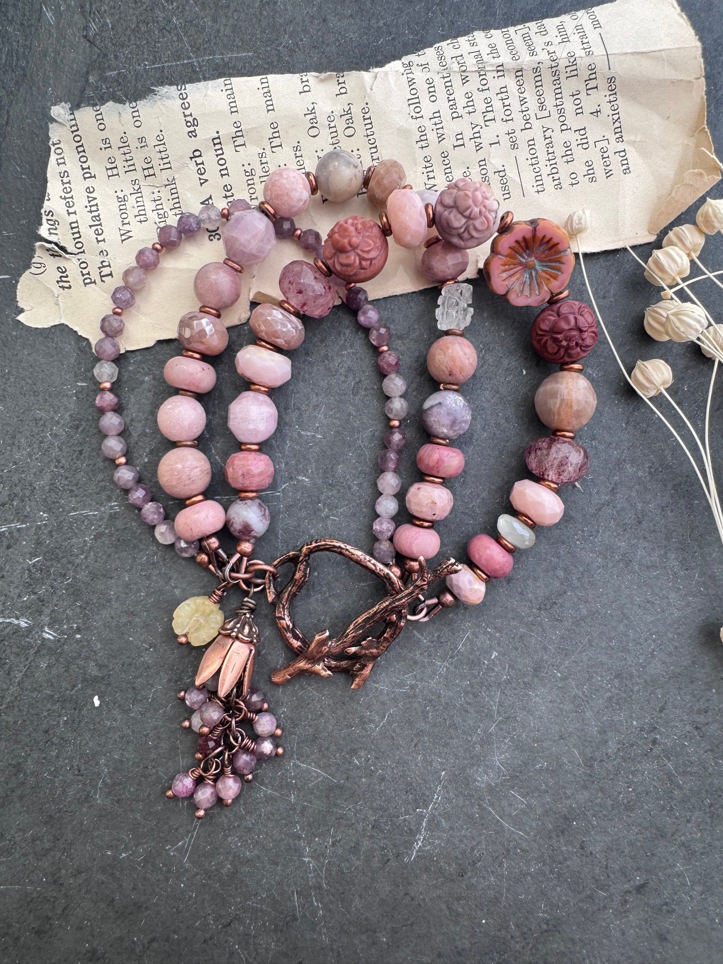 Mongolian agate carved flower, Ruby, Czech glass flower, rhodochrosite, strawberry quartz, moonstone, pink opal, purple mica, Lilac Lepidolite and copper clasp.