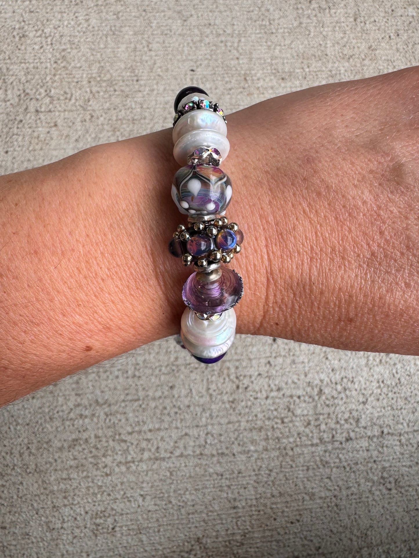Cosmic. Handmade lampwork glass, cosmic tiger eye, pearls, rhinestones, moonstone, amethyst, silver metal, bracelet