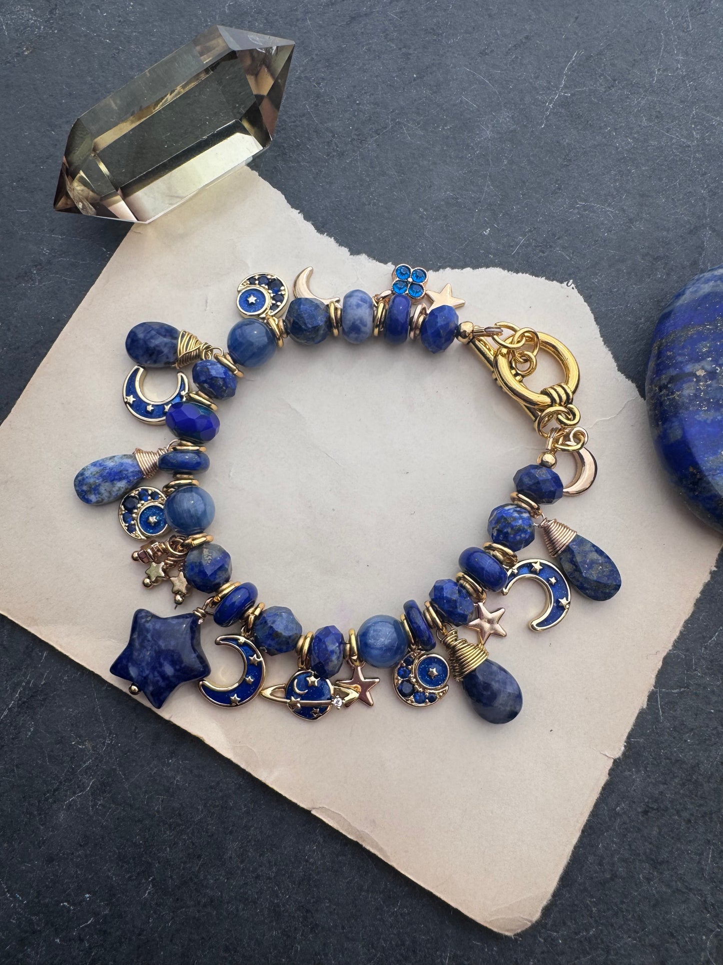 Space Charm bracelet. Mixed gemstone, charms and gold metal bracelet.