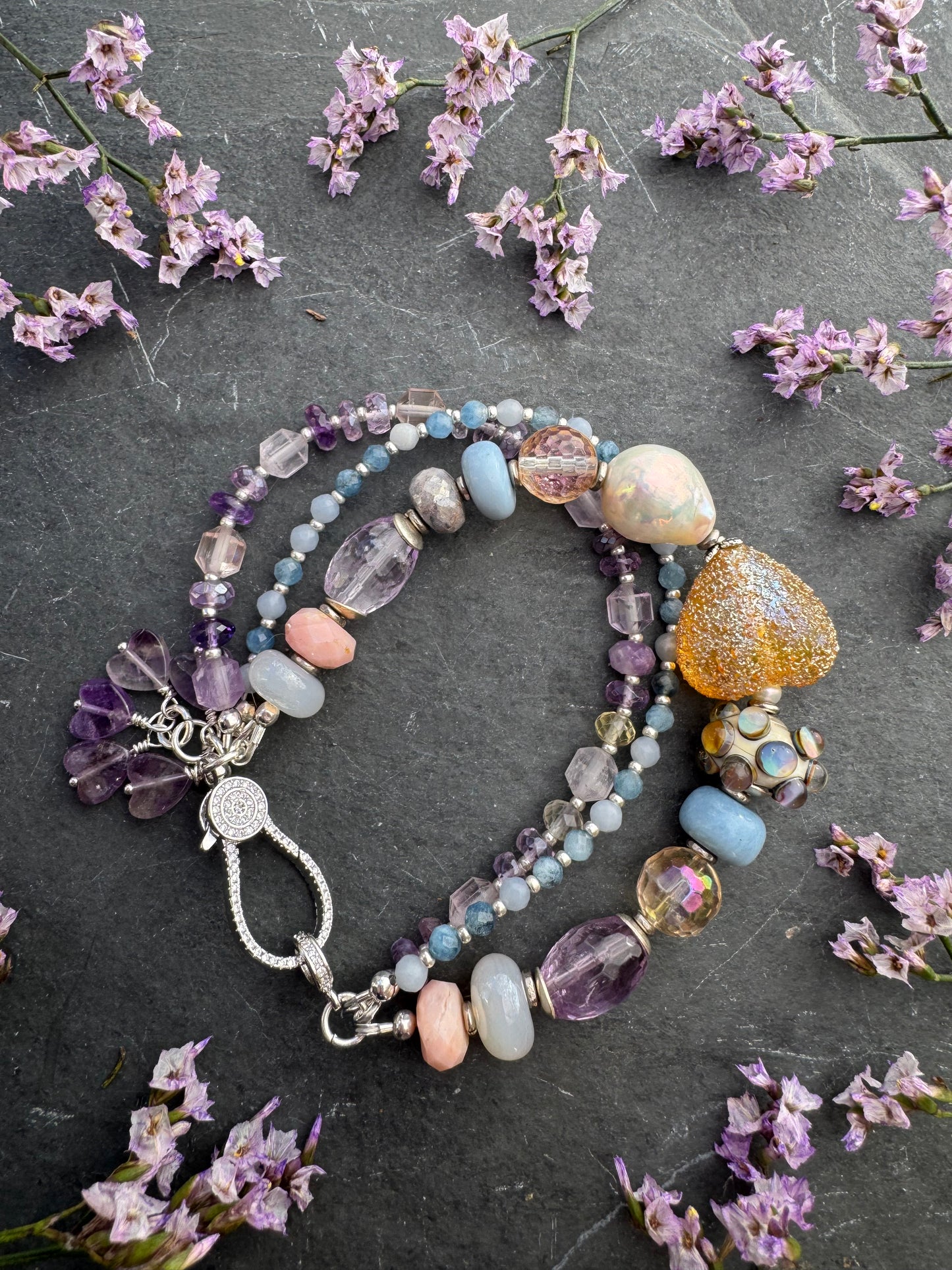 handmade lampwork glass, baroque pearl, blue opal, citrine with AB, moonstone, labradorite, pink opal, amethyst, and kyanite. Rhinestone clasp. Bracelet.