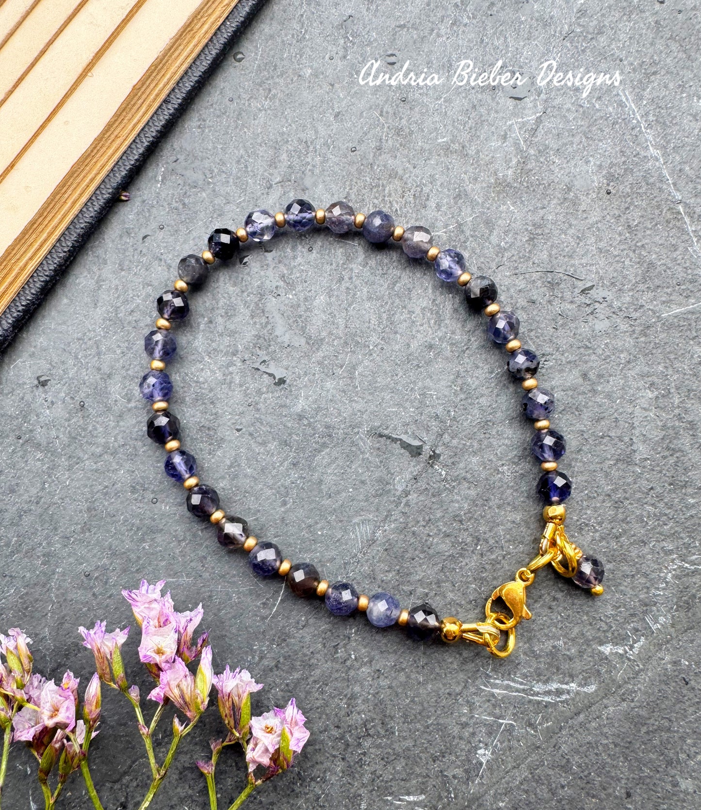 Iolite faceted stone, gold metal, bracelet