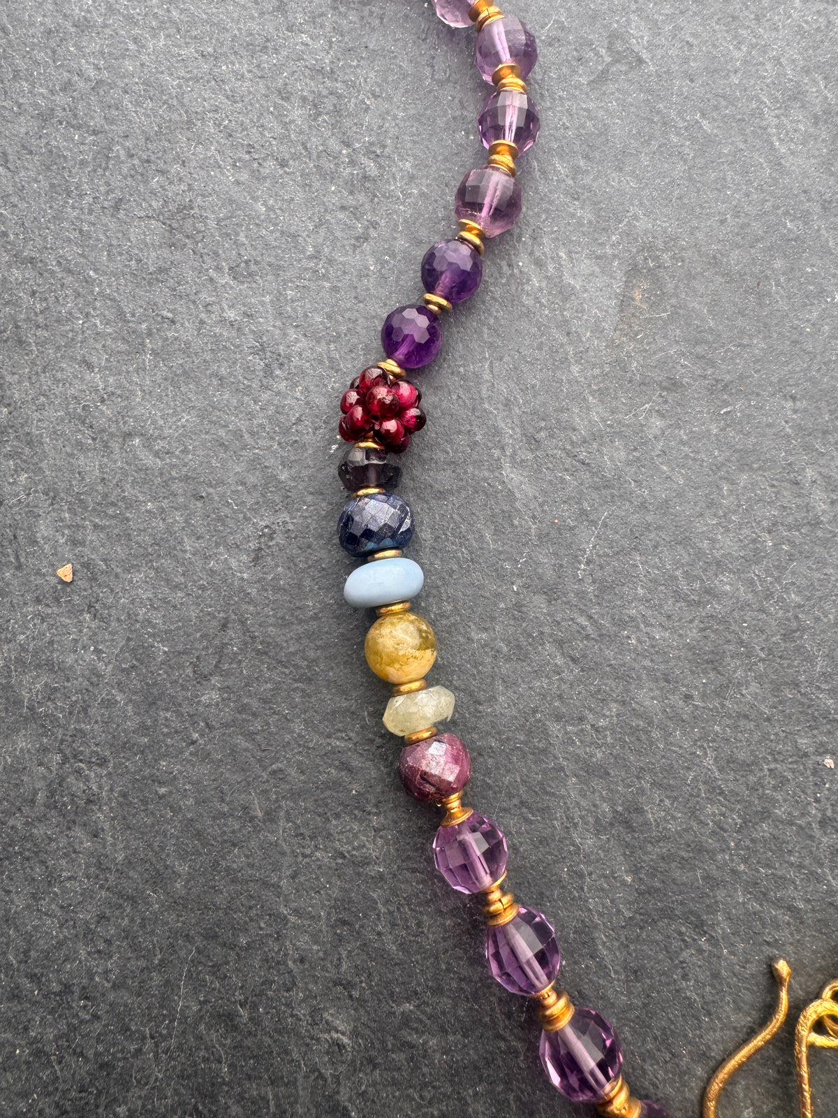 Amethyst faceted gemstone, iolite, green garnet, garnet, prehnite, peridot, aquamarine, blue opal and brass metal, necklace.