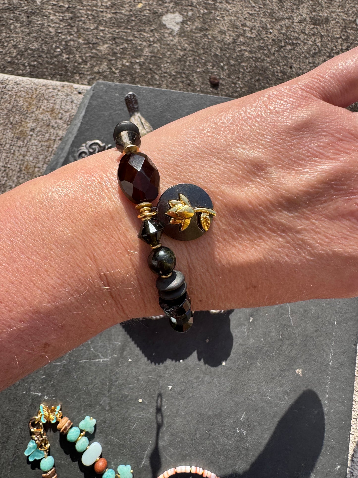 Black tourmaline, agate, black onyx stone, gold metal bracelet.