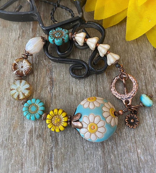 Daisy. Ceramic focal, sunflower czech glass beads, copper metal, bracelet.