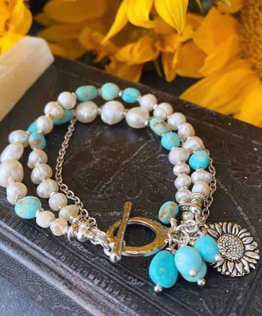 Turquoise stone, pearl, chain, silver metal, bracelet. Published in B A Magazine