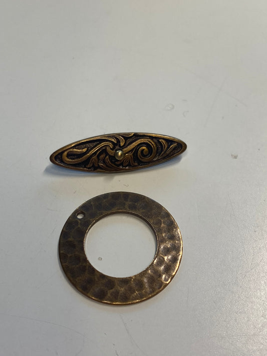 Hammered hoop and filigree toggle bar clasp. Chocolate brown bronze metal.