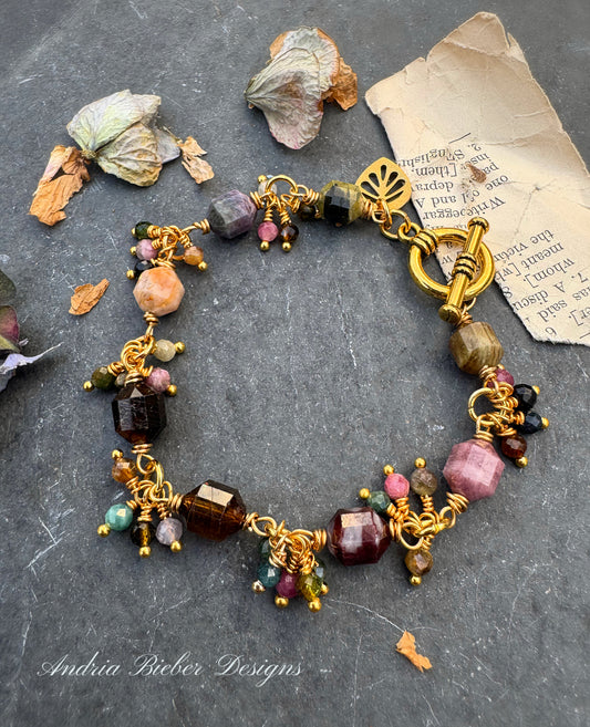 Watermelon tourmaline stone, wire wrapped, gold metal bracelet.