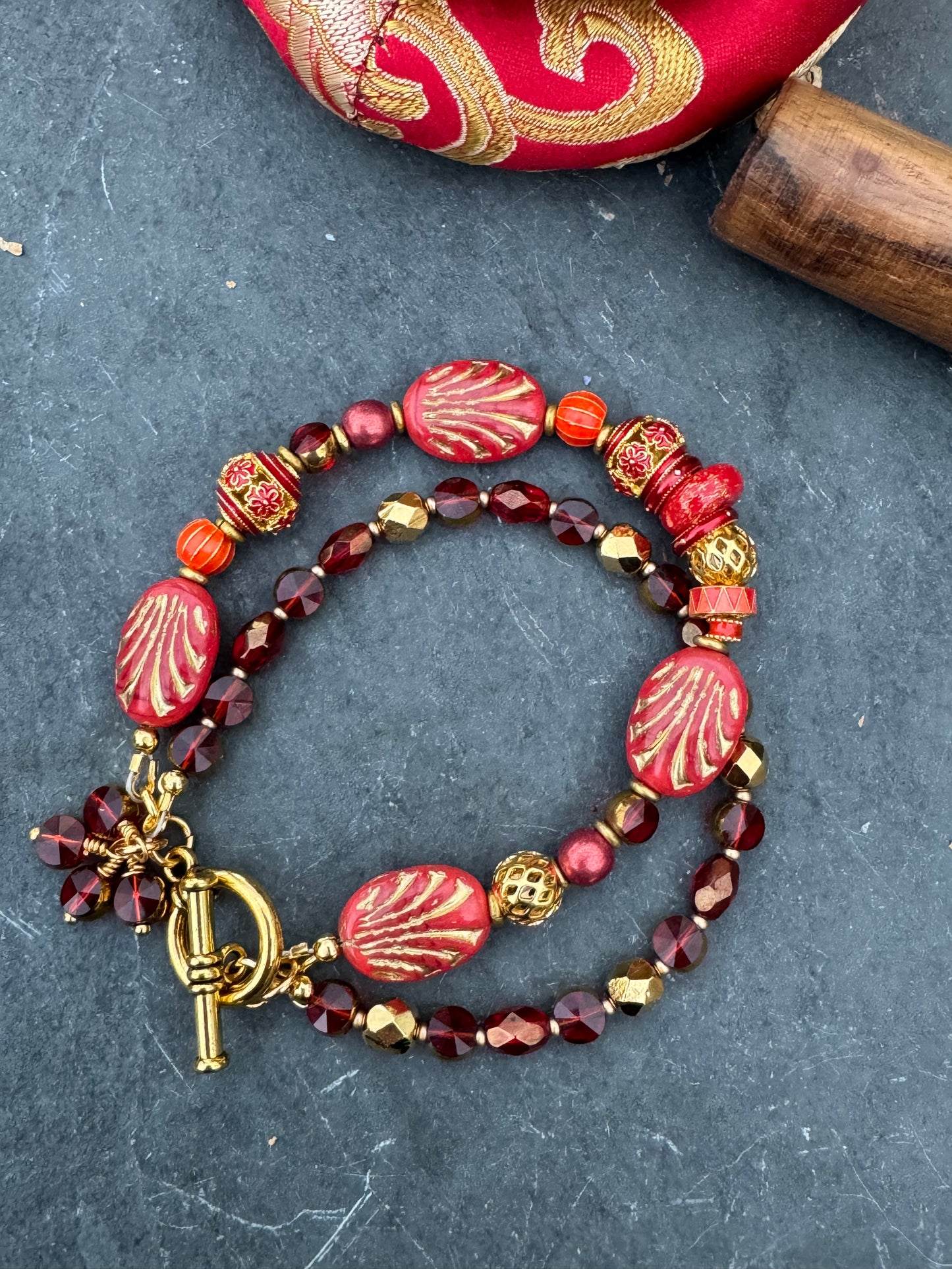 Red Czech glass, red coral, cloisonne, gold metal, bracelet