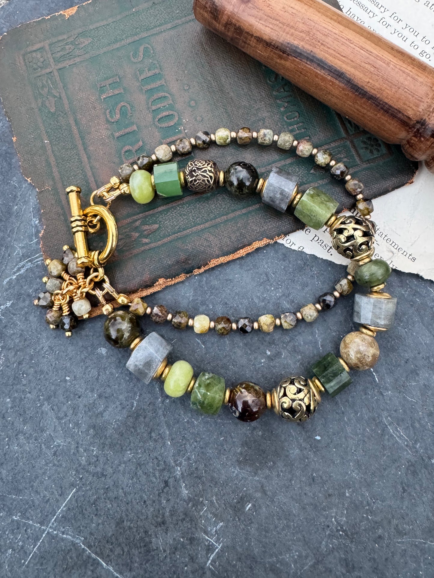 Green garnet, labradorite, jade, and gold metal, bracelet.