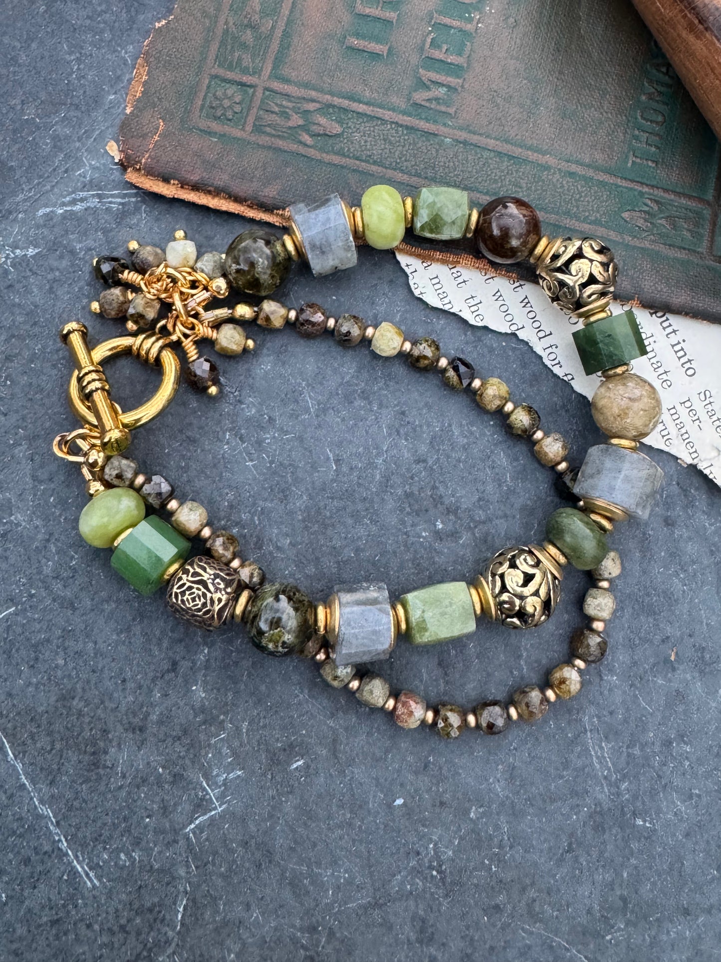 Green garnet, labradorite, jade, and gold metal, bracelet.