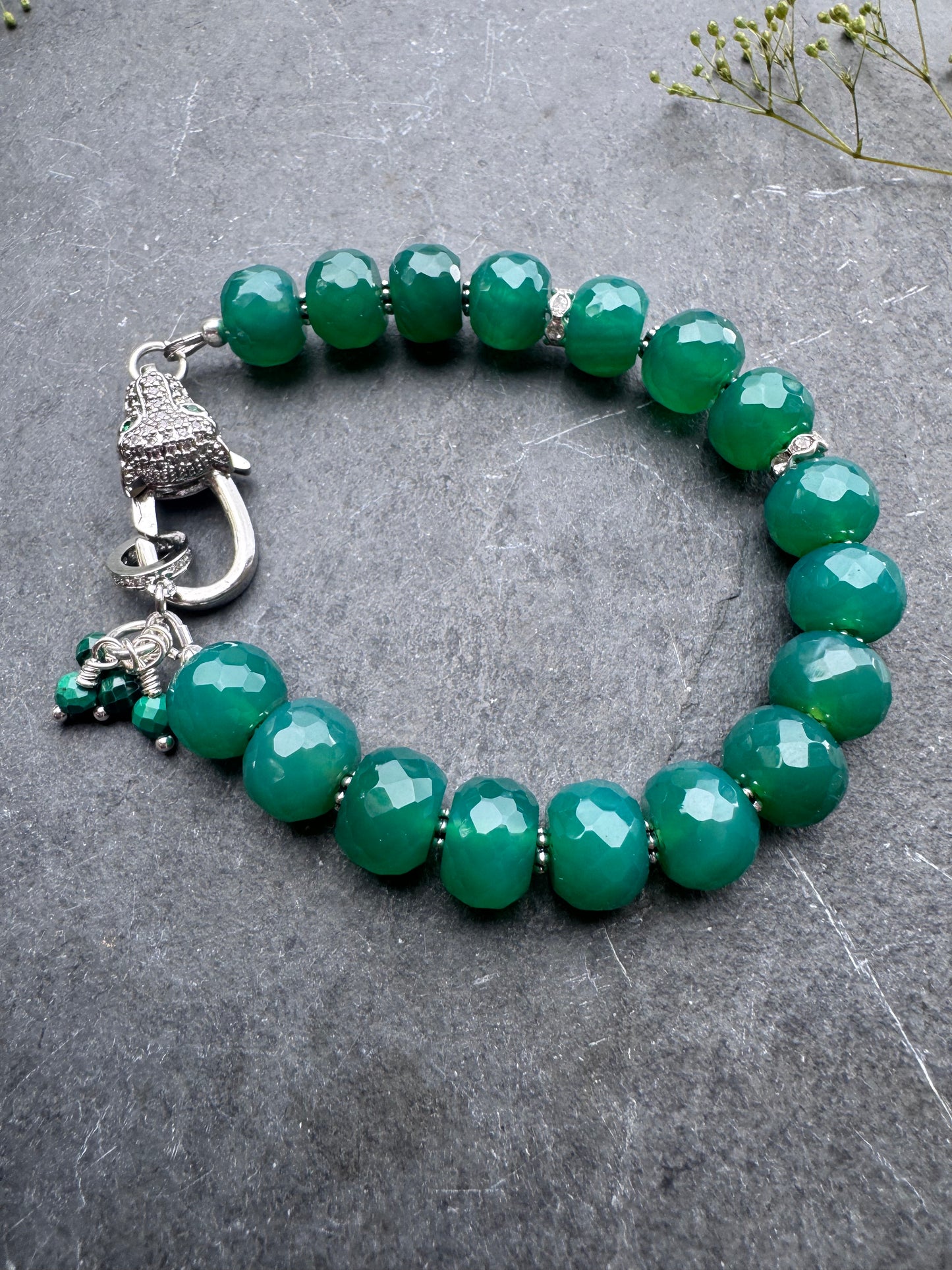 Green onyx faceted stone, jaguar silver rhinestone clasp.