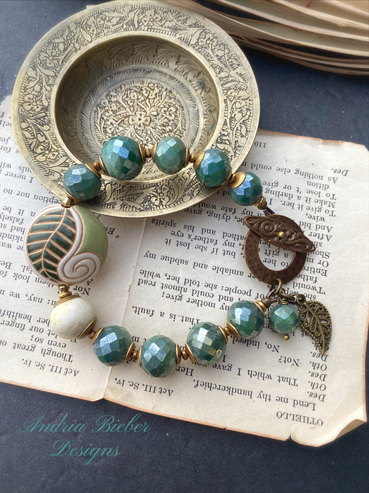 Ceramic leaf bead, green faceted mystic coated jade, African brass, bronze metal, bracelet