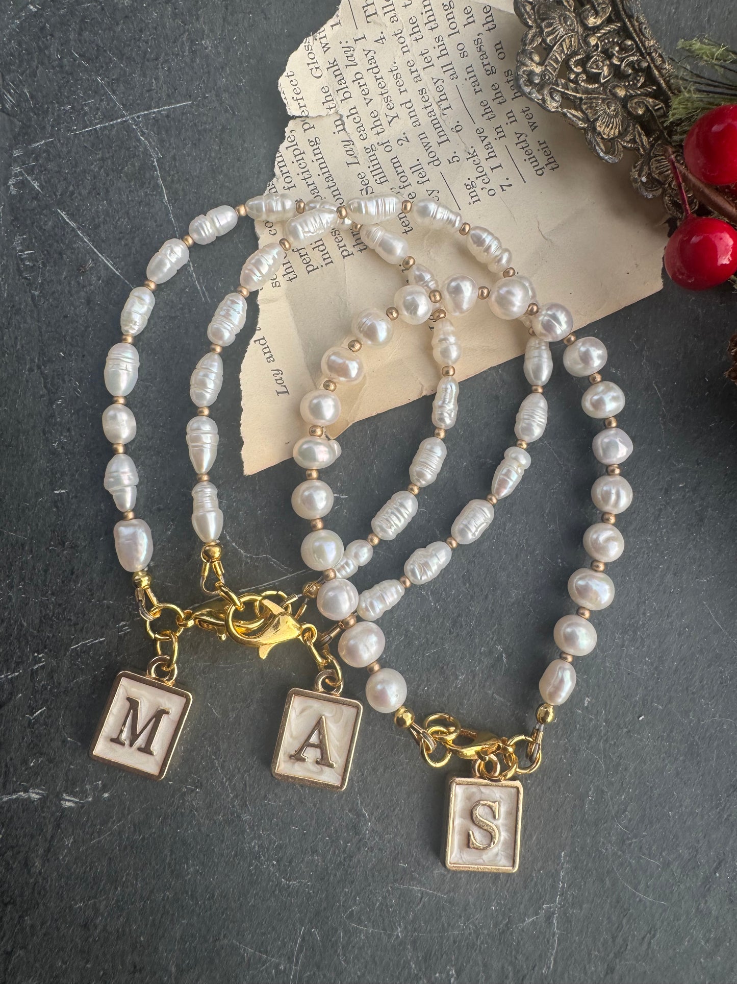 Pearl (freshwater) and initial charm bracelet. Gold and pearlescent letter charm.
