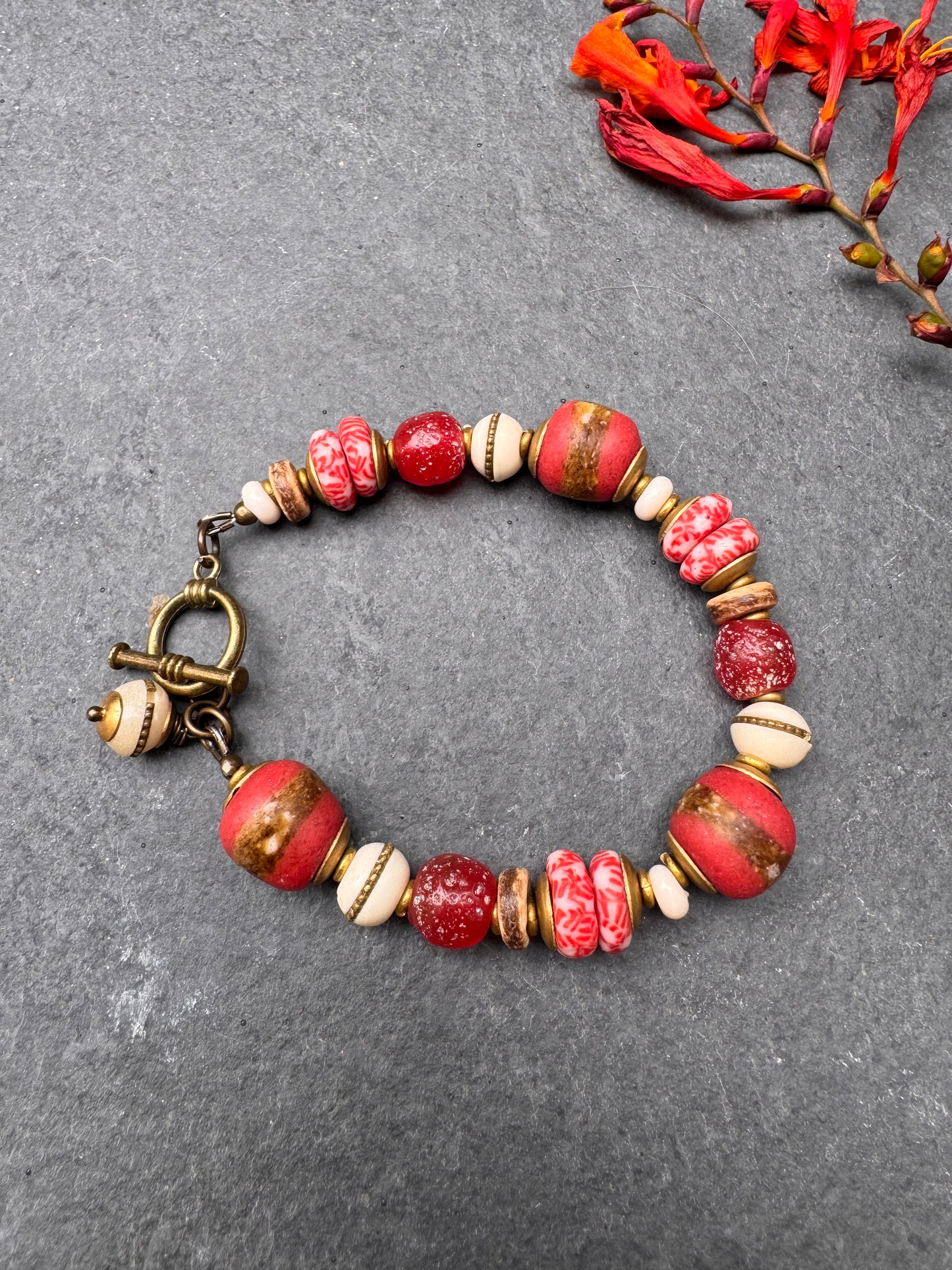 Red African glass, bone, wood, bronze metal, bracelet