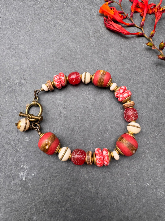 Red African glass, bone, wood, bronze metal, bracelet