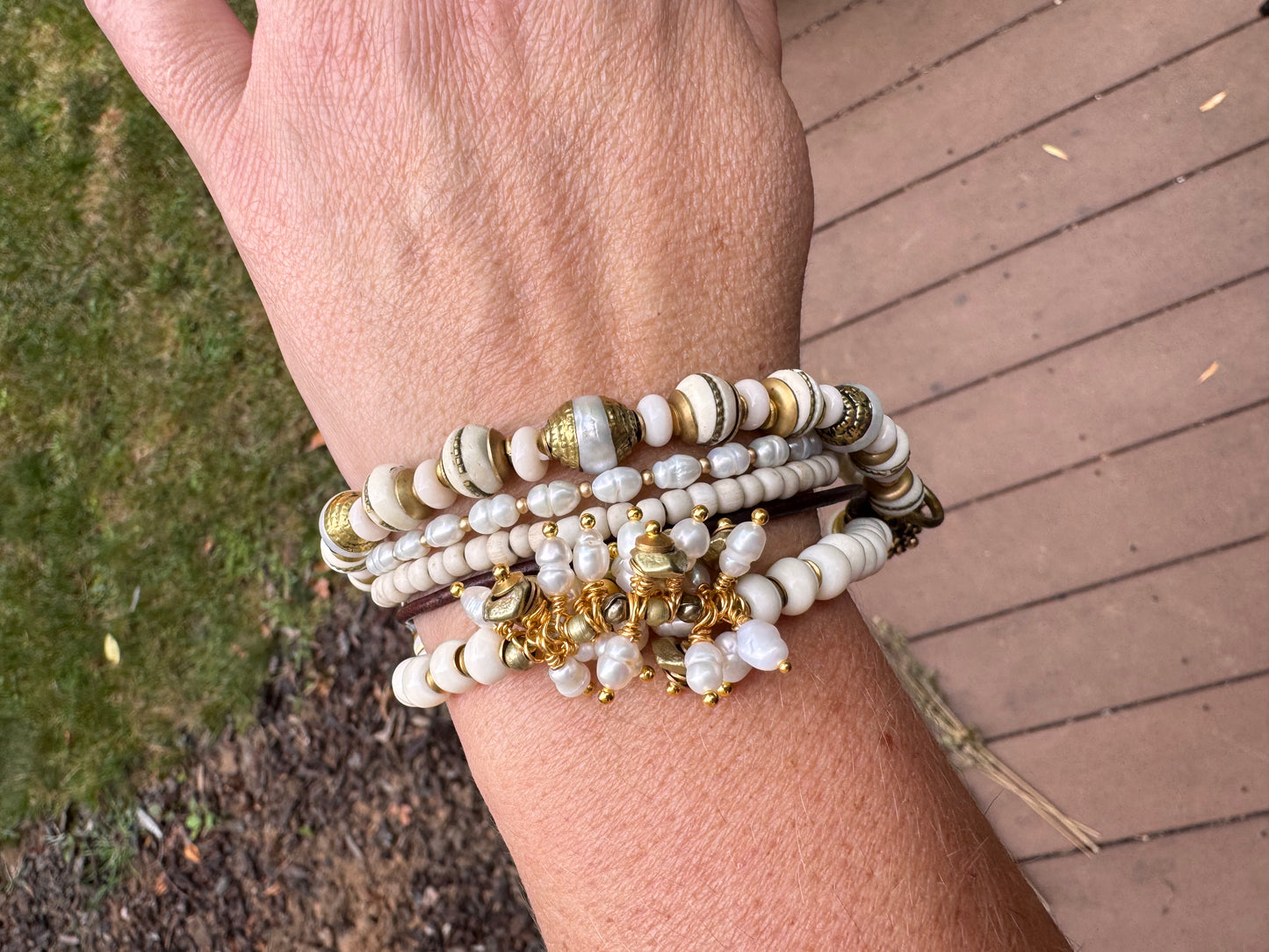 Pearls, leather, glass, brass metal bracelet.