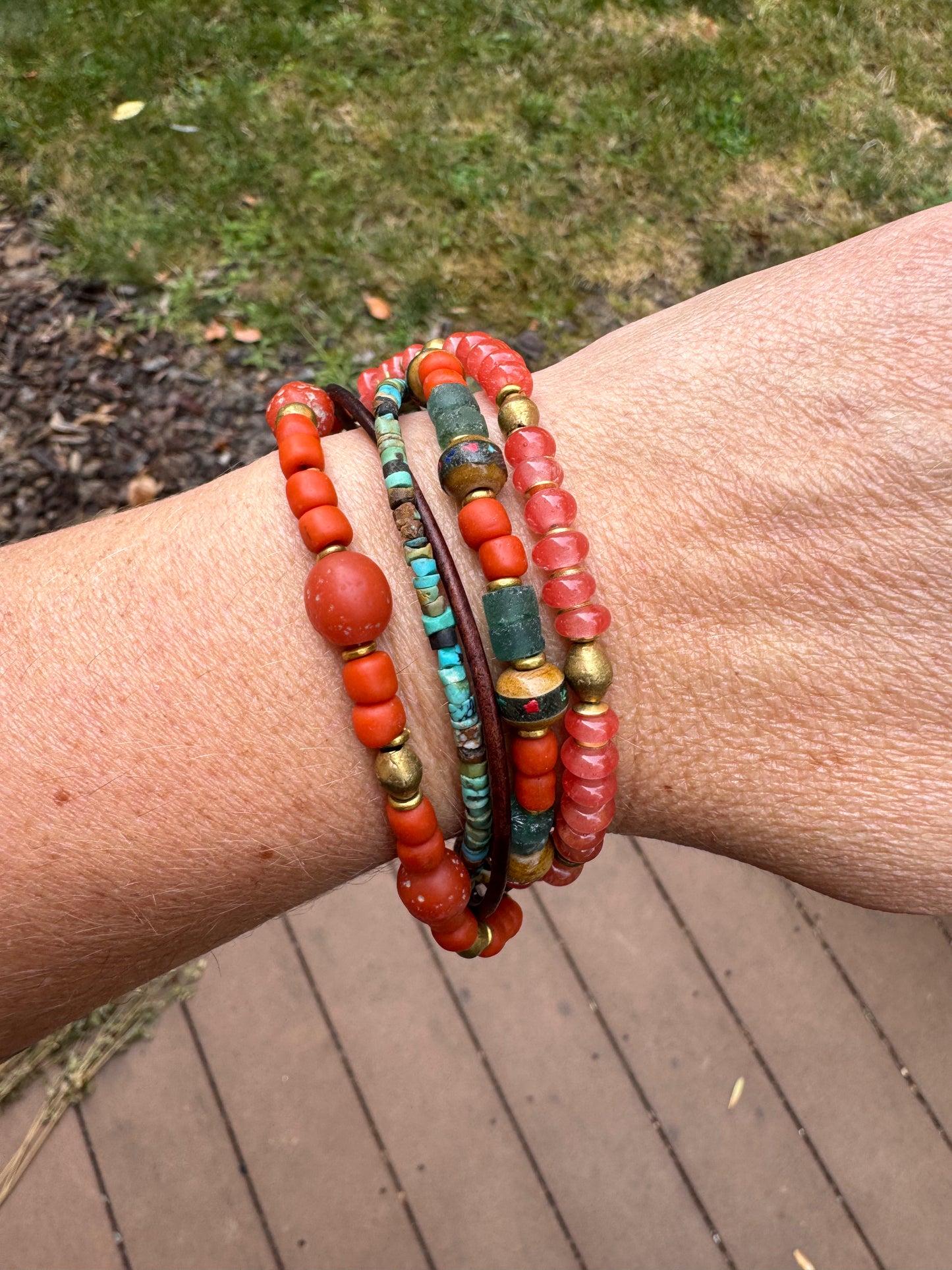 Turquoise, leather, African glass, wood, agate, brass metal bracelet.