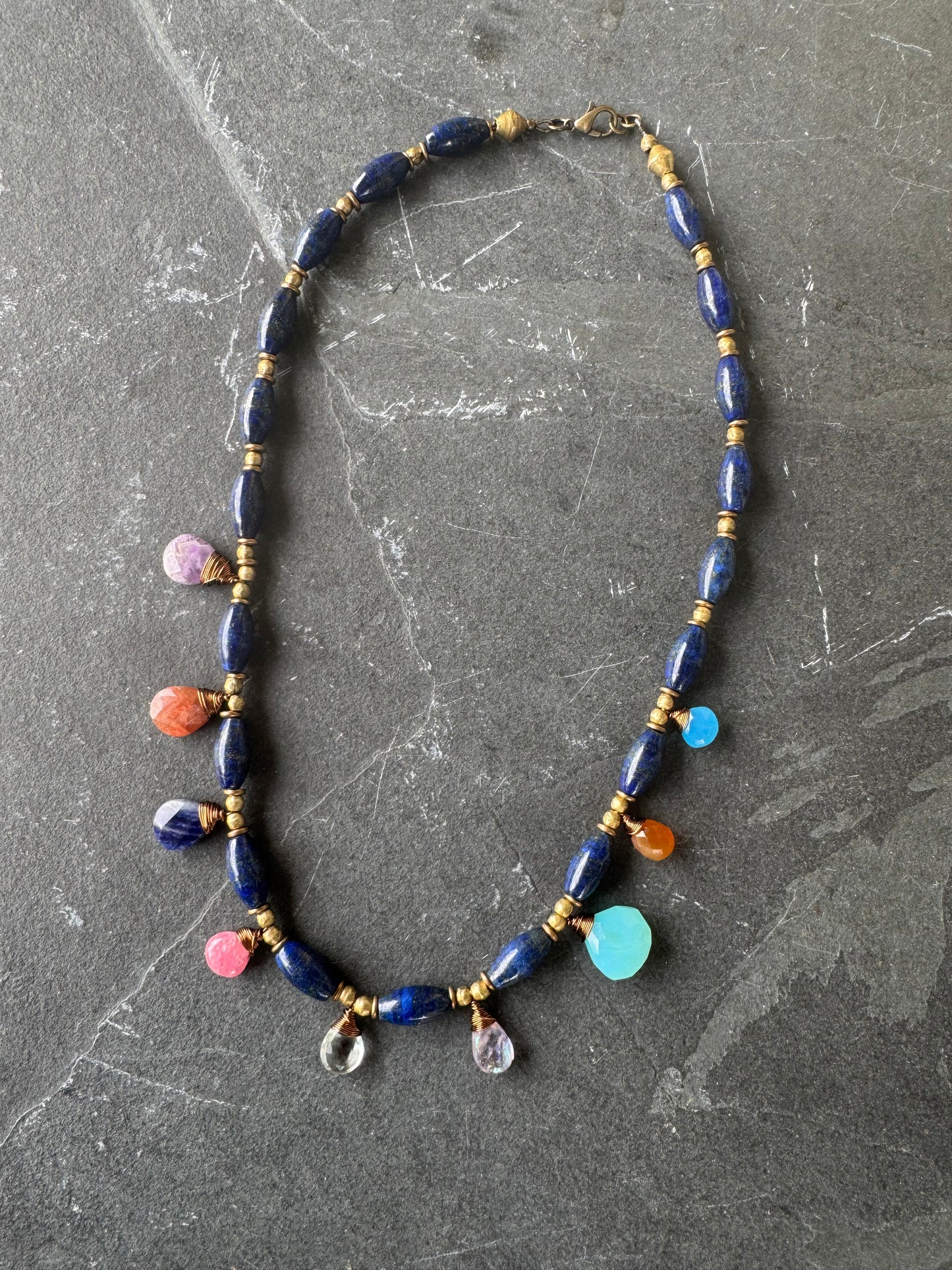 Lapis stone and mixed gemstone necklace. African brass.