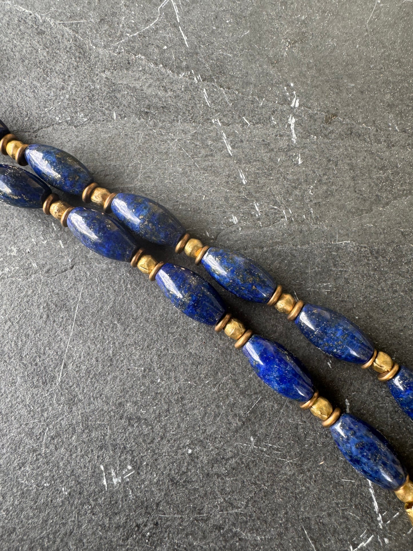 Lapis stone and mixed gemstone necklace. African brass.