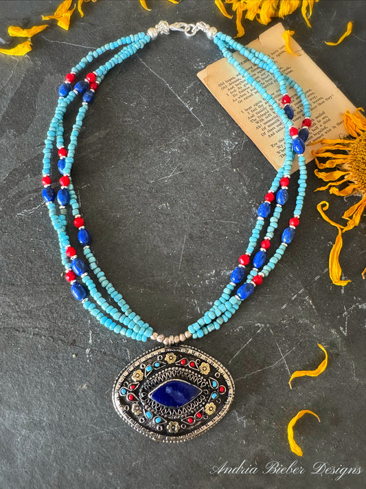 Kit. Afghanistan lapis pendant, blue glass beads, coral, lapis lazuli stone, silver metal, necklace.