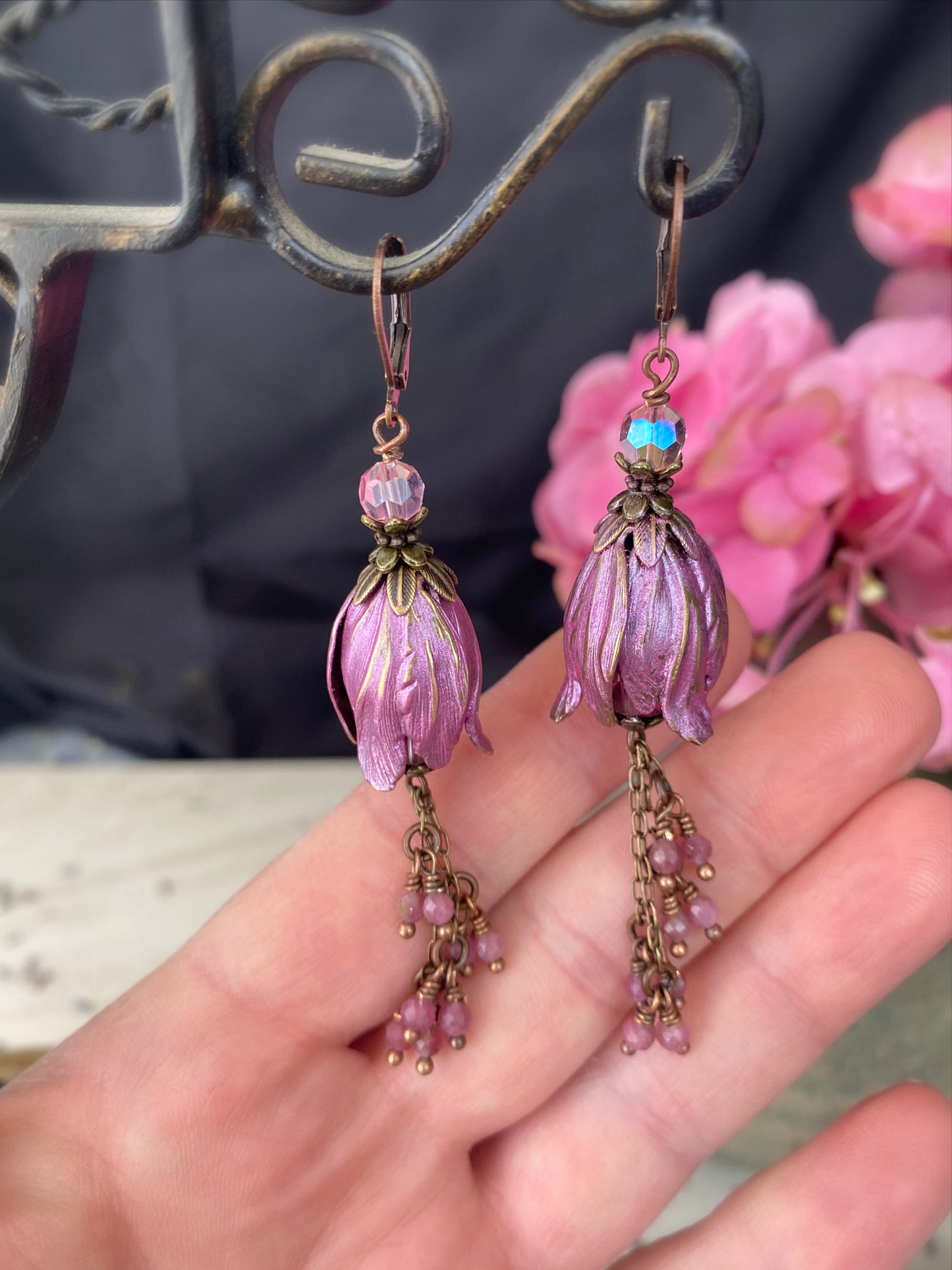 Pink crystal glass, pink tourmaline stone, flower bead caps, and copper metal earrings.