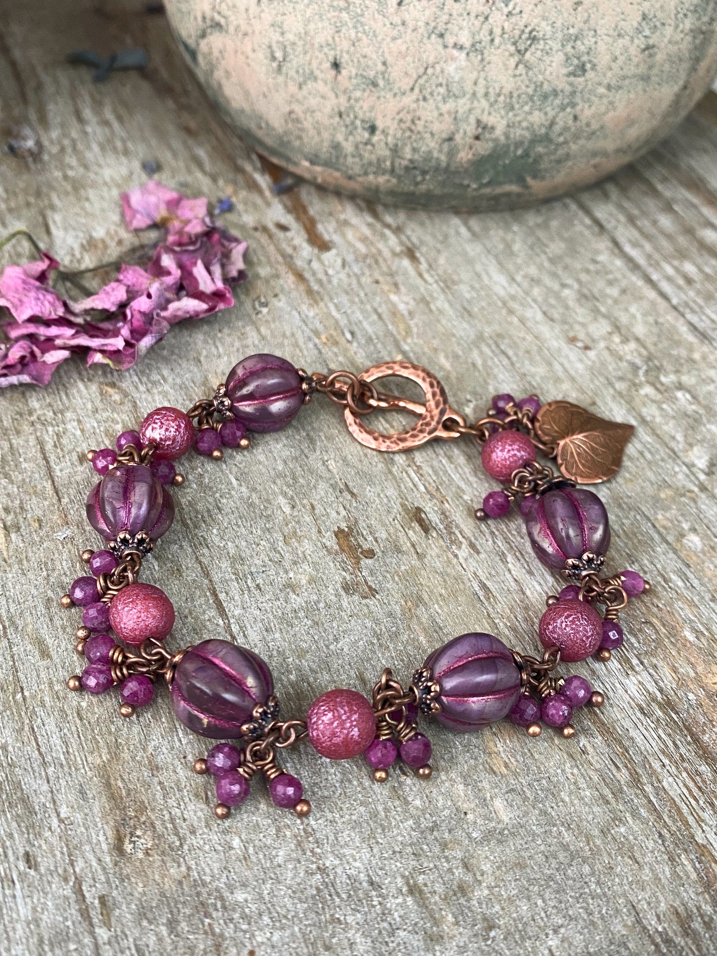 Pink Czech glass, ruby gemstones, copper metal, bracelet.