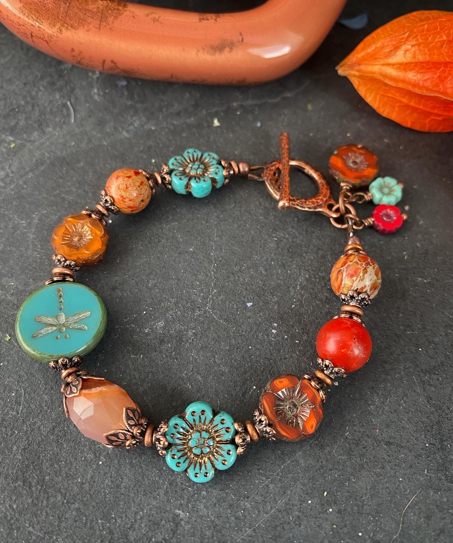 Flower Czech glass in turquoise, orange jasper, agate, copper metal bracelet.