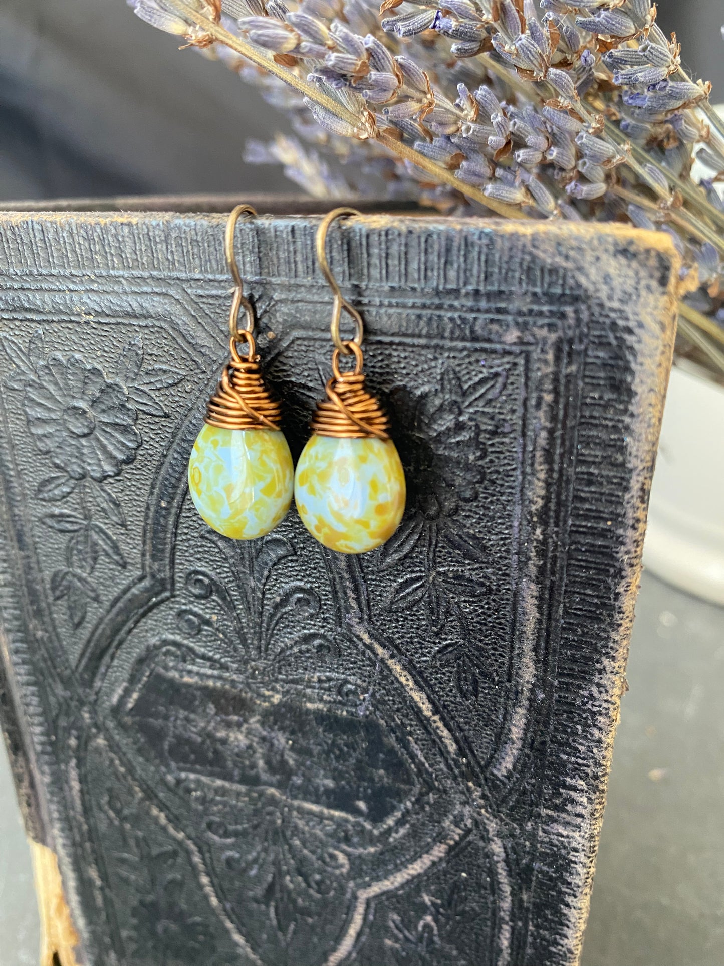Teardrop glass in blue and green and bronze wire wrapped earrings.