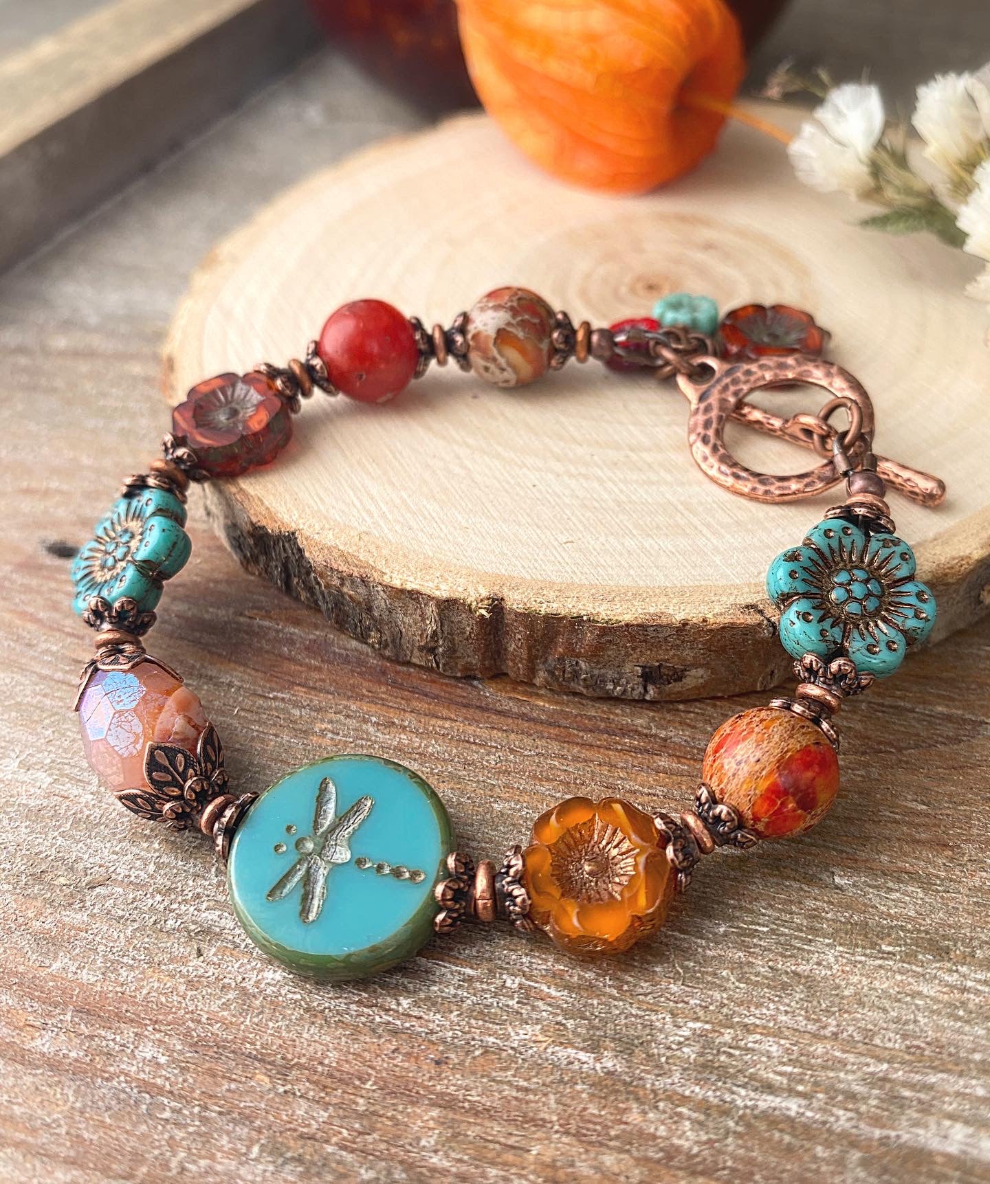 Flower Czech glass in turquoise, orange jasper, agate, copper metal bracelet.
