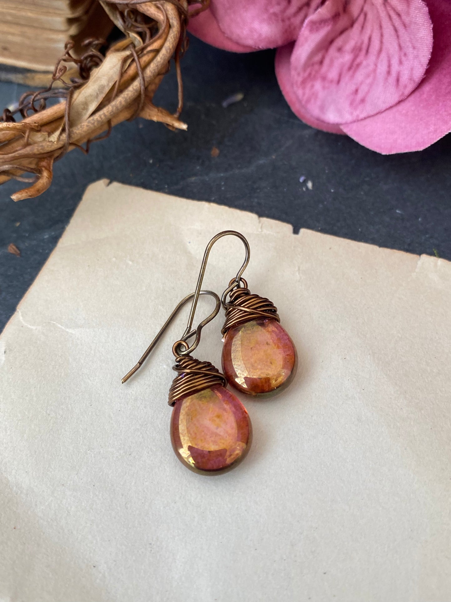 Teardrop glass in pink and gold hues and bronze wire wrapped earrings.