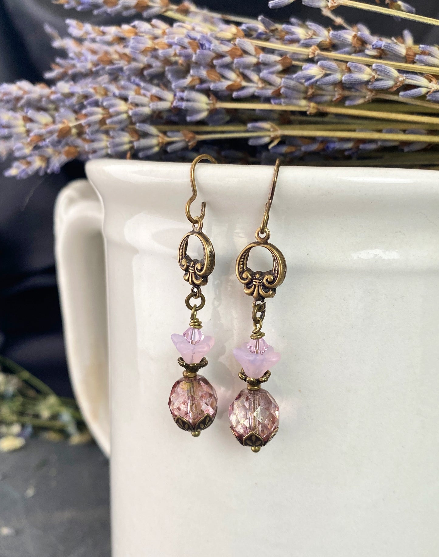 Pink Czech glass, bronze flower bead caps, and bronze metal earrings.