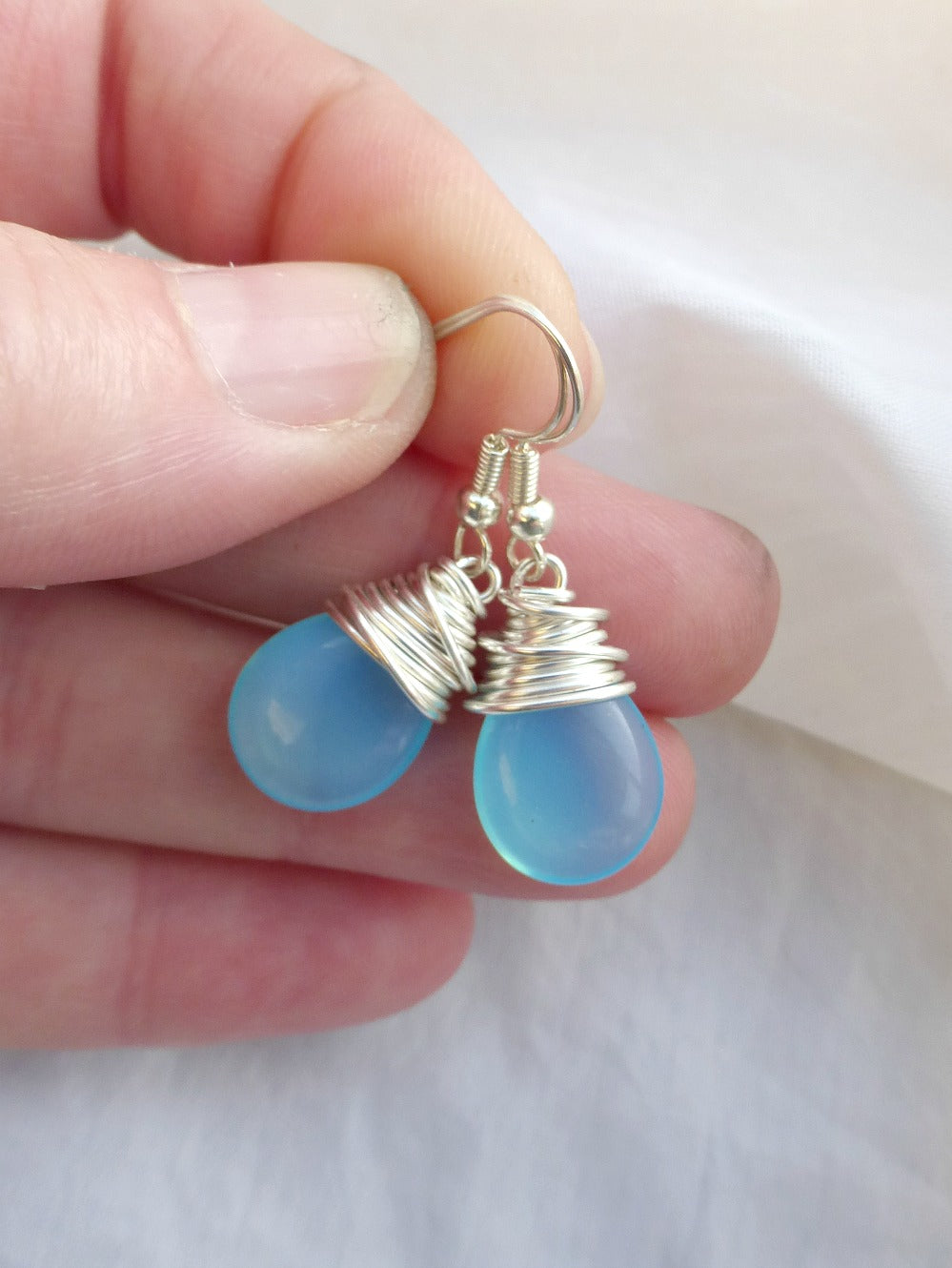 Sky blue transparent teardrop Czech Picasso glass, silver wire wrapping, sterling silver earrings. - Andria Bieber Designs 