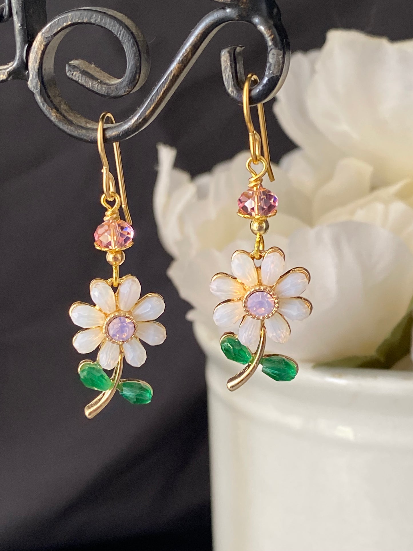 Pink crystal flowers, gold metal earrings, jewelry.