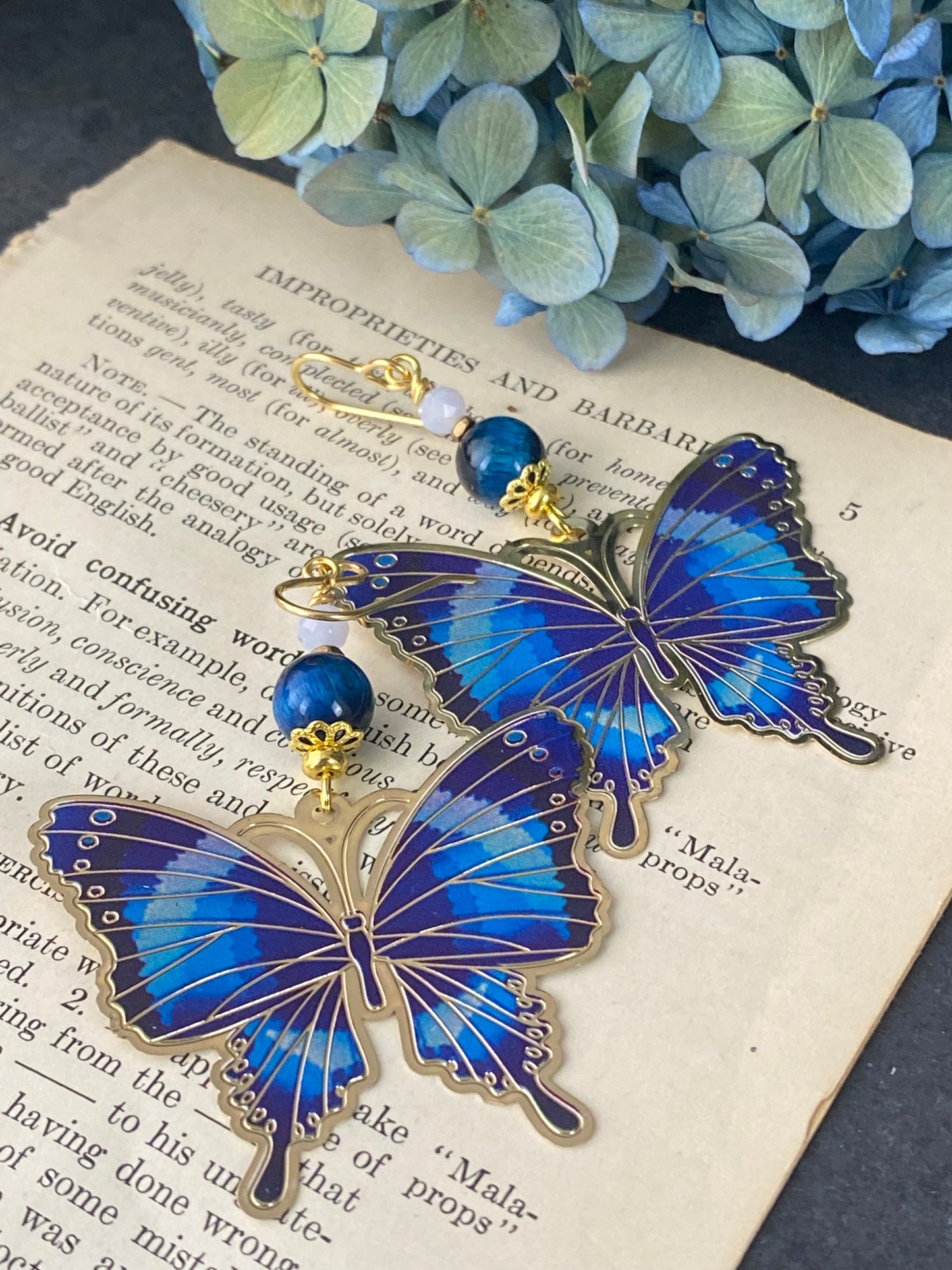 Blue tigers eye, blue butterfly charms, gold metal earrings. - Andria Bieber Designs 