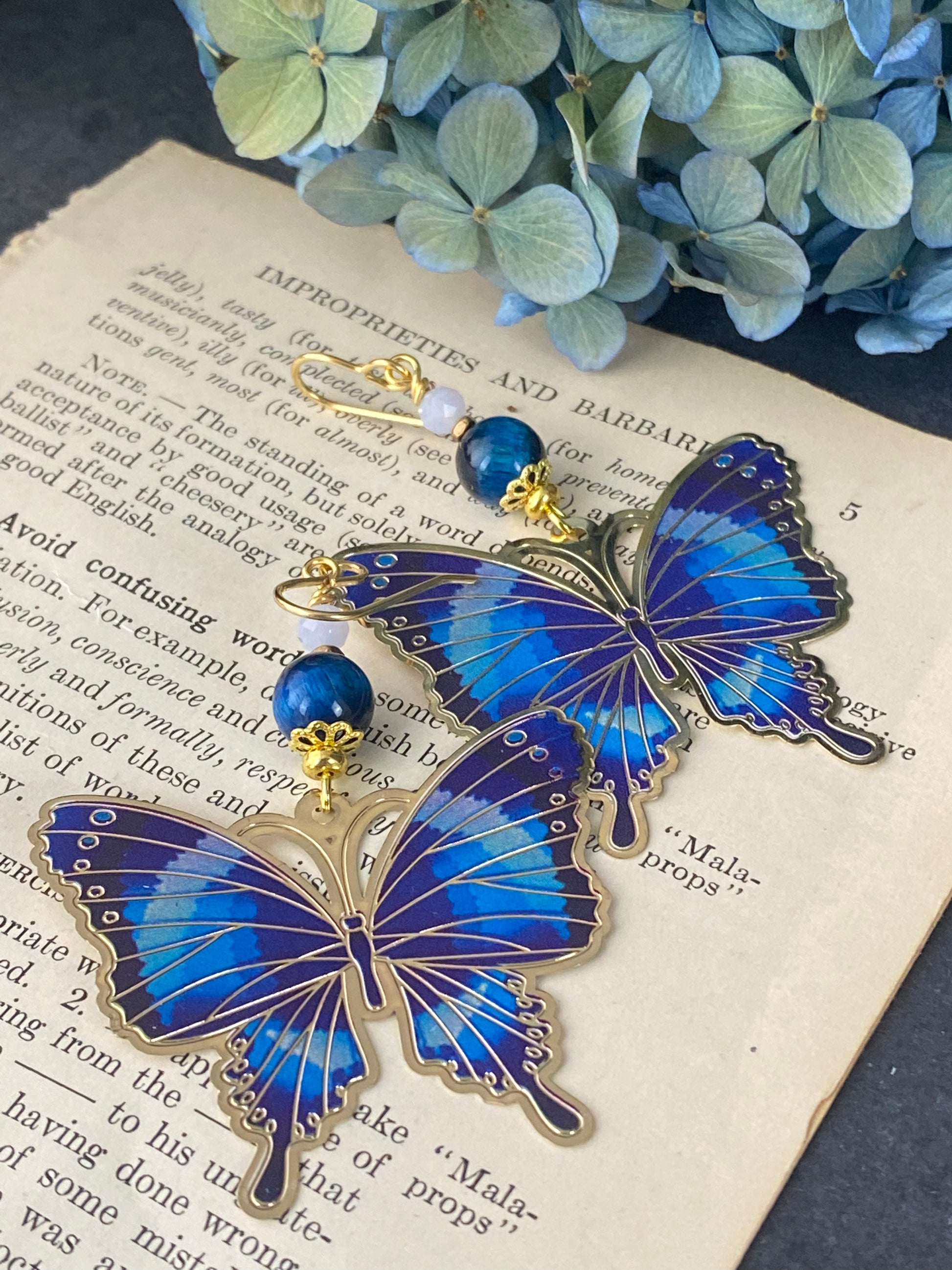 Blue tigers eye, blue butterfly charms, gold metal earrings. – Andria  Bieber Designs