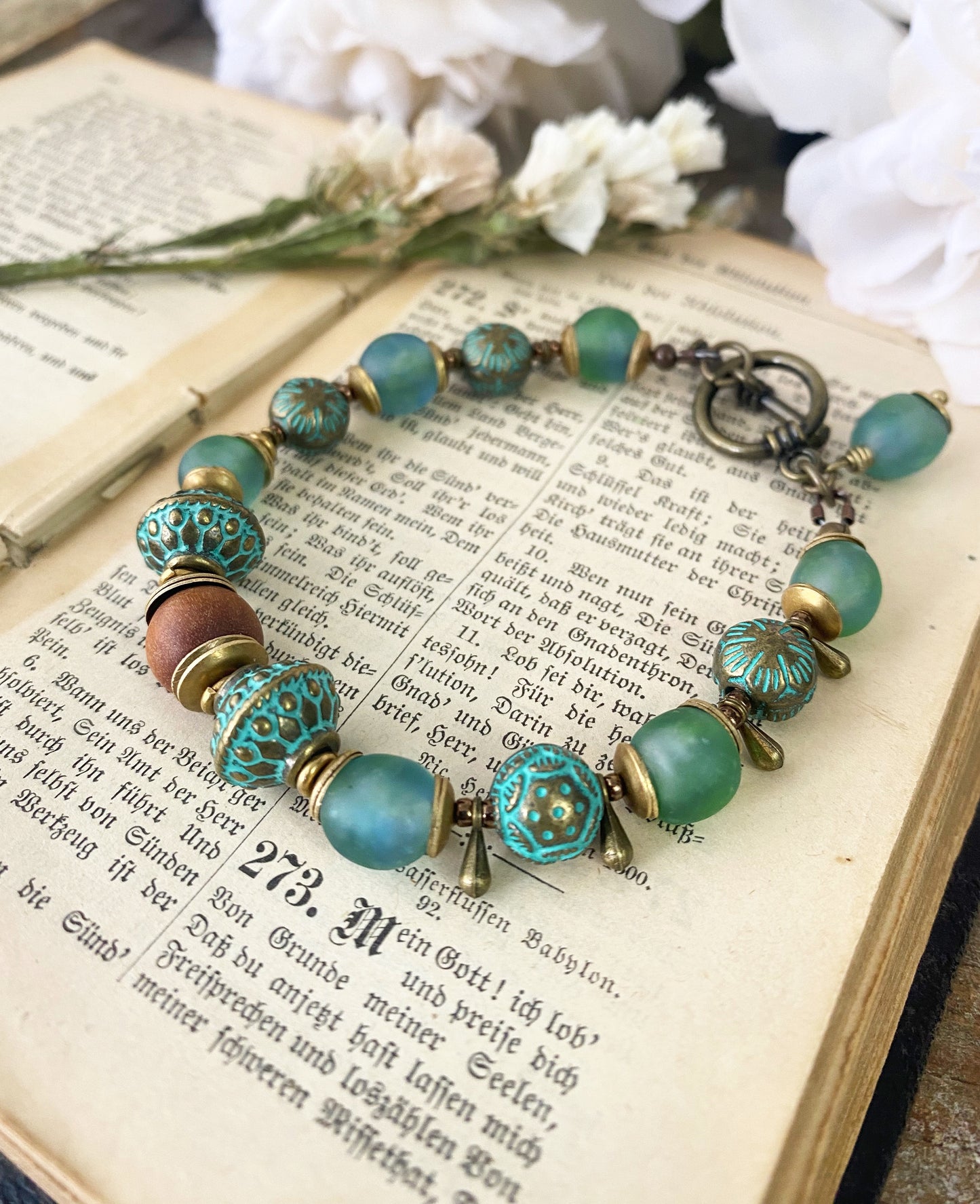 African recycled glass, green patina beads, African brass, sandalwood, bracelet.