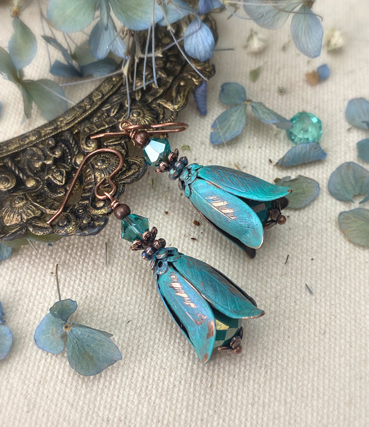 Turquoise Czech glass, crystals, Vintaj beads, and copper metal earrings.