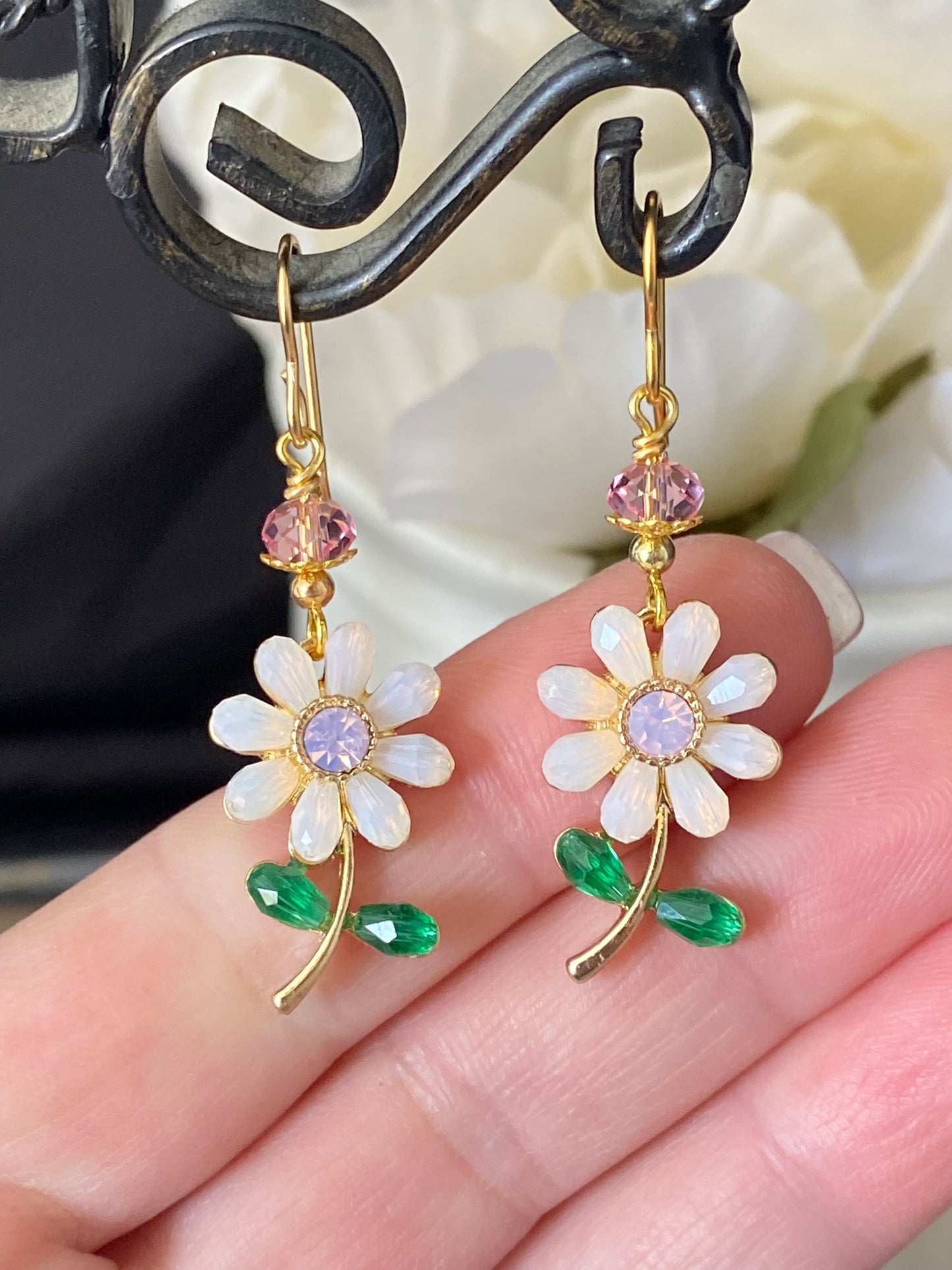 Pink crystal flowers, gold metal earrings, jewelry.
