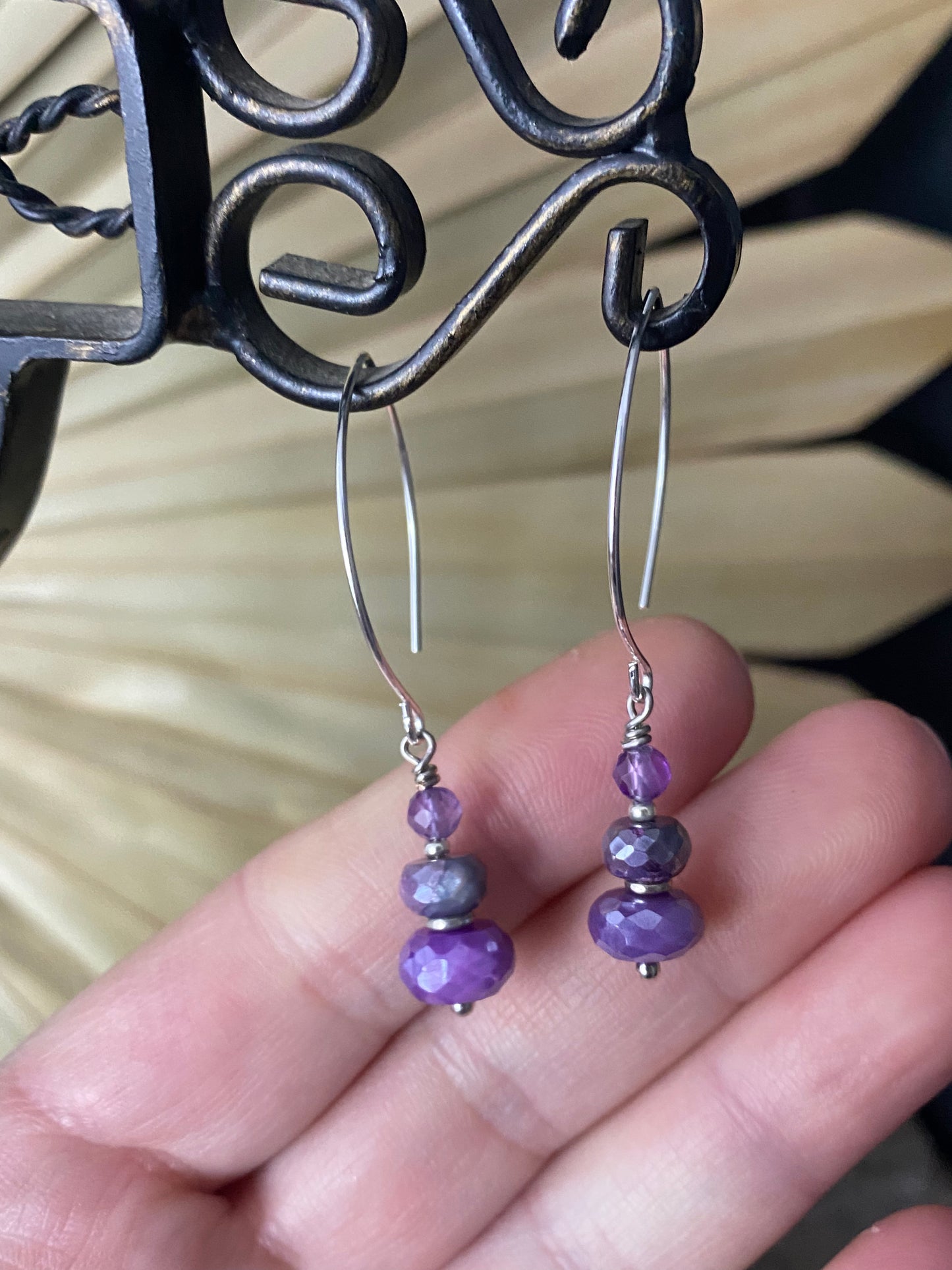 Amethyst purple gemstone faceted and silver metal earrings.