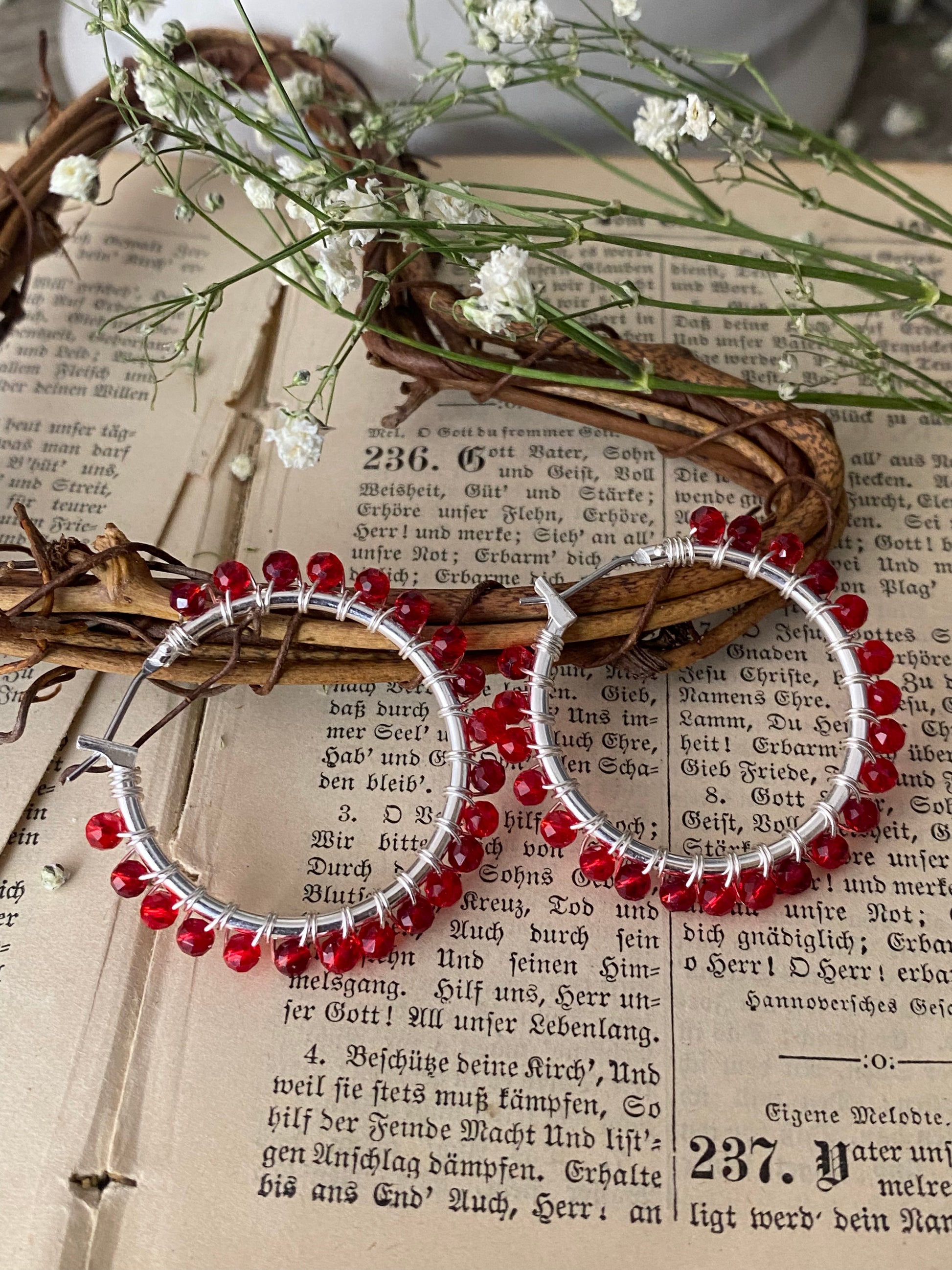 Red crystals, silver metal hoops, wire wrapped, earrings - Andria Bieber Designs 