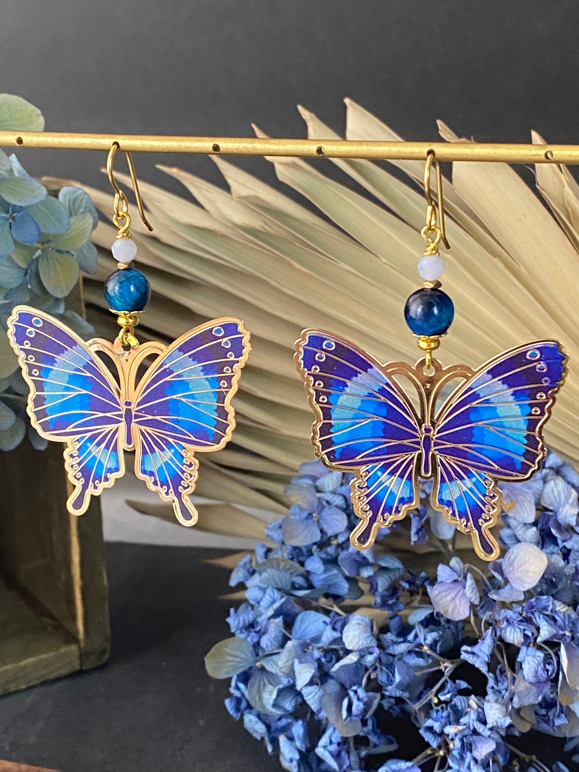 Blue tigers eye, blue butterfly charms, gold metal earrings. - Andria Bieber Designs 