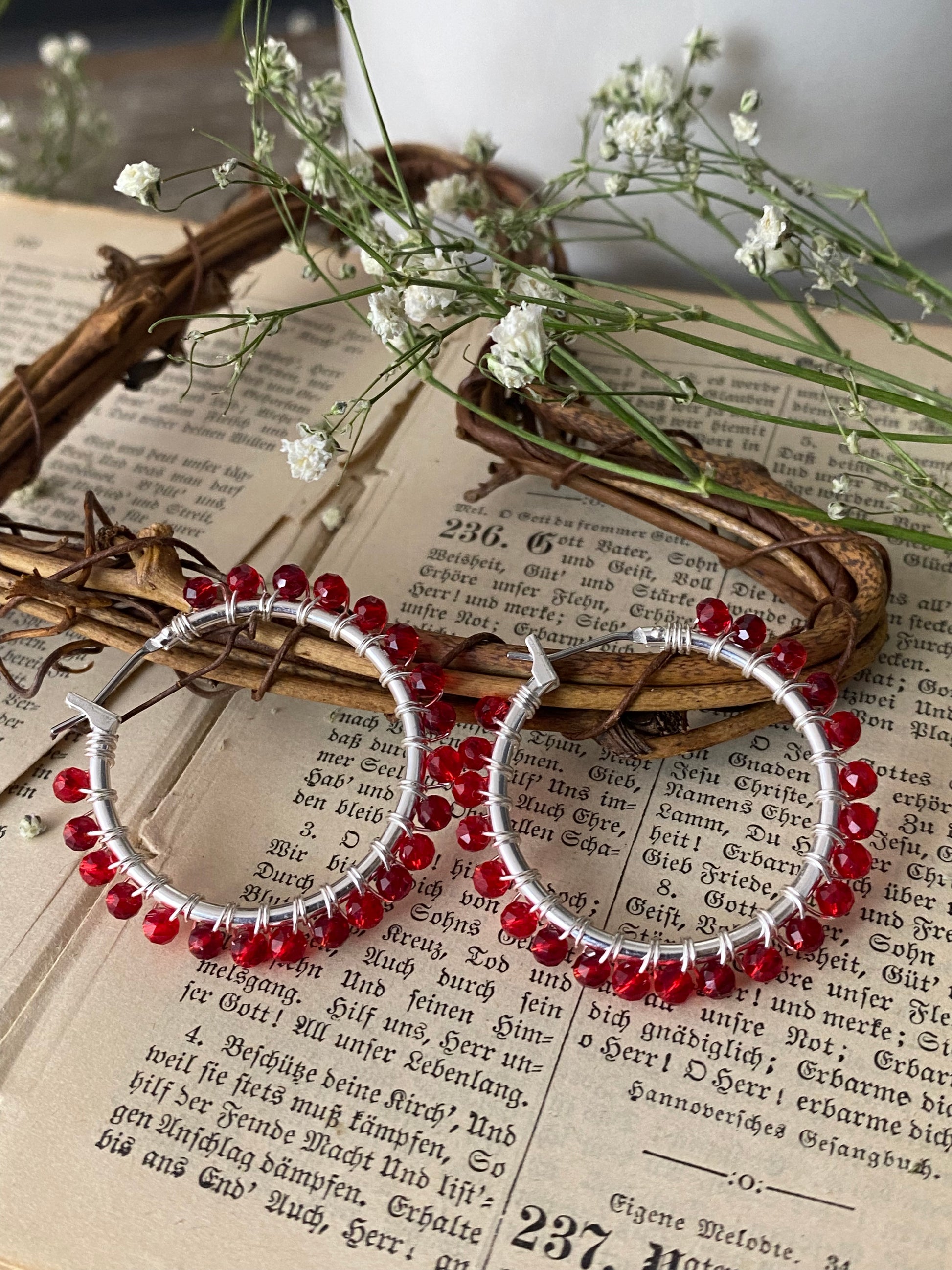 Red crystals, silver metal hoops, wire wrapped, earrings - Andria Bieber Designs 