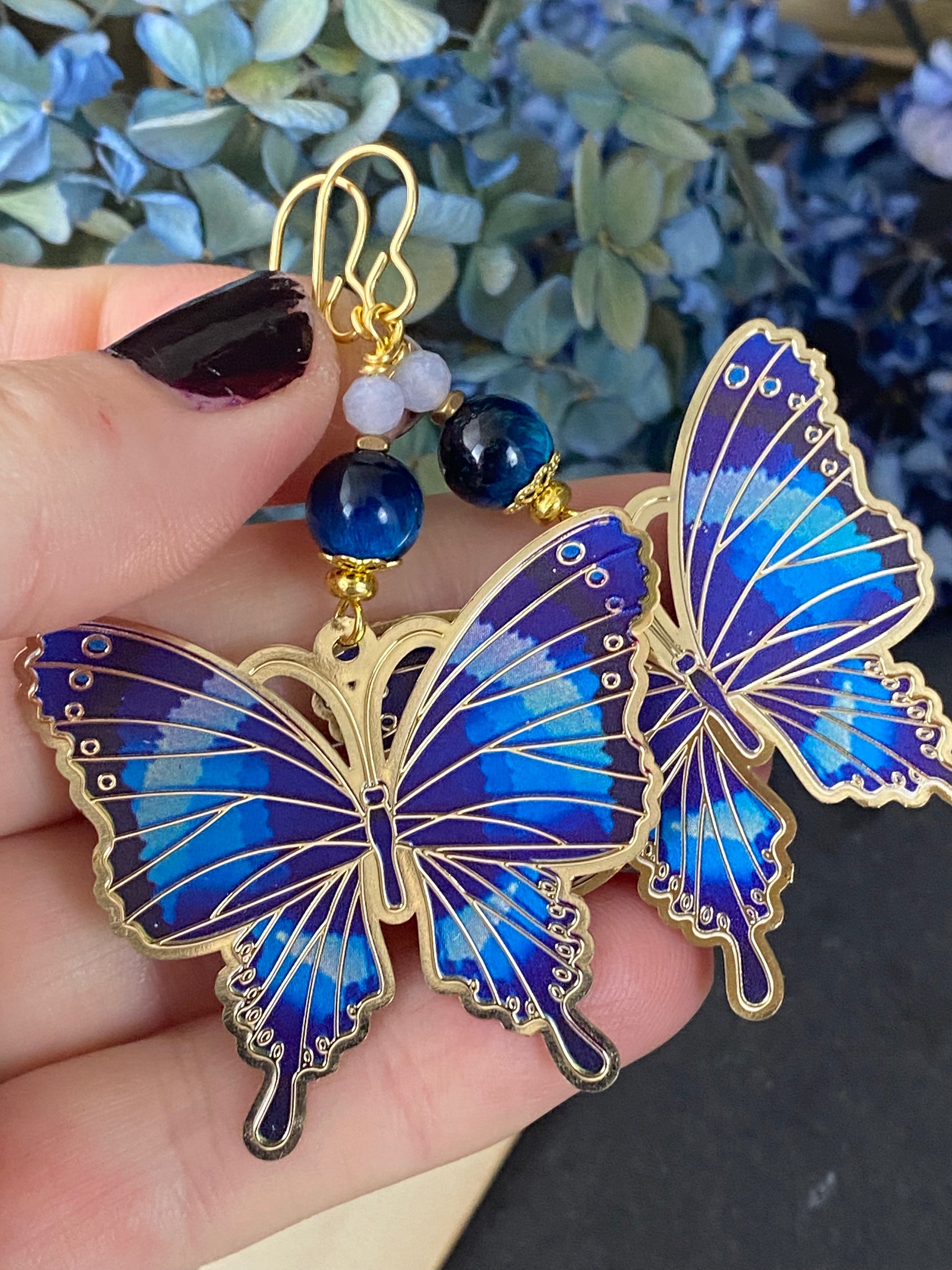 Blue tigers eye, blue butterfly charms, gold metal earrings. – Andria  Bieber Designs