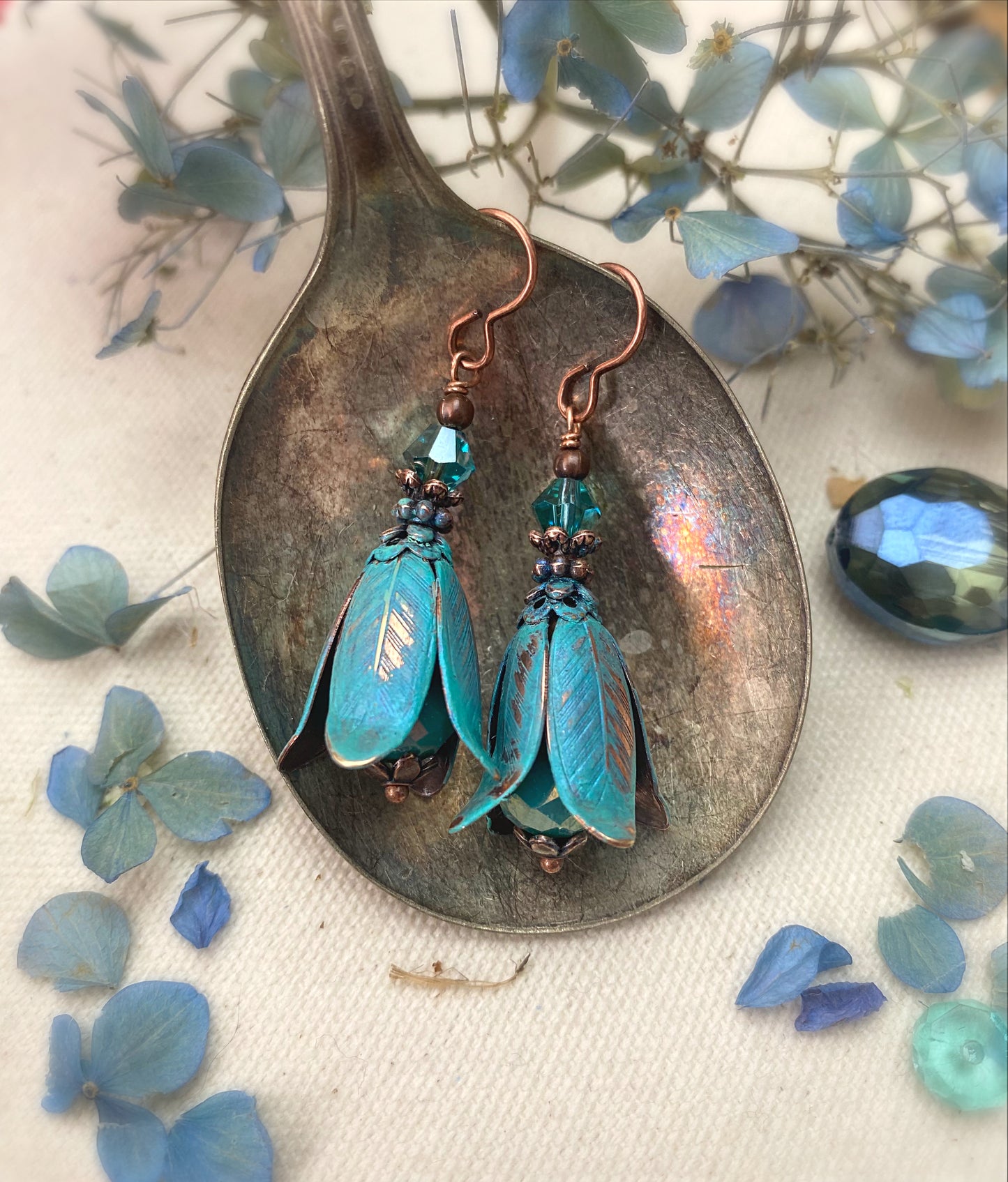 Turquoise Czech glass, crystals, Vintaj beads, and copper metal earrings.